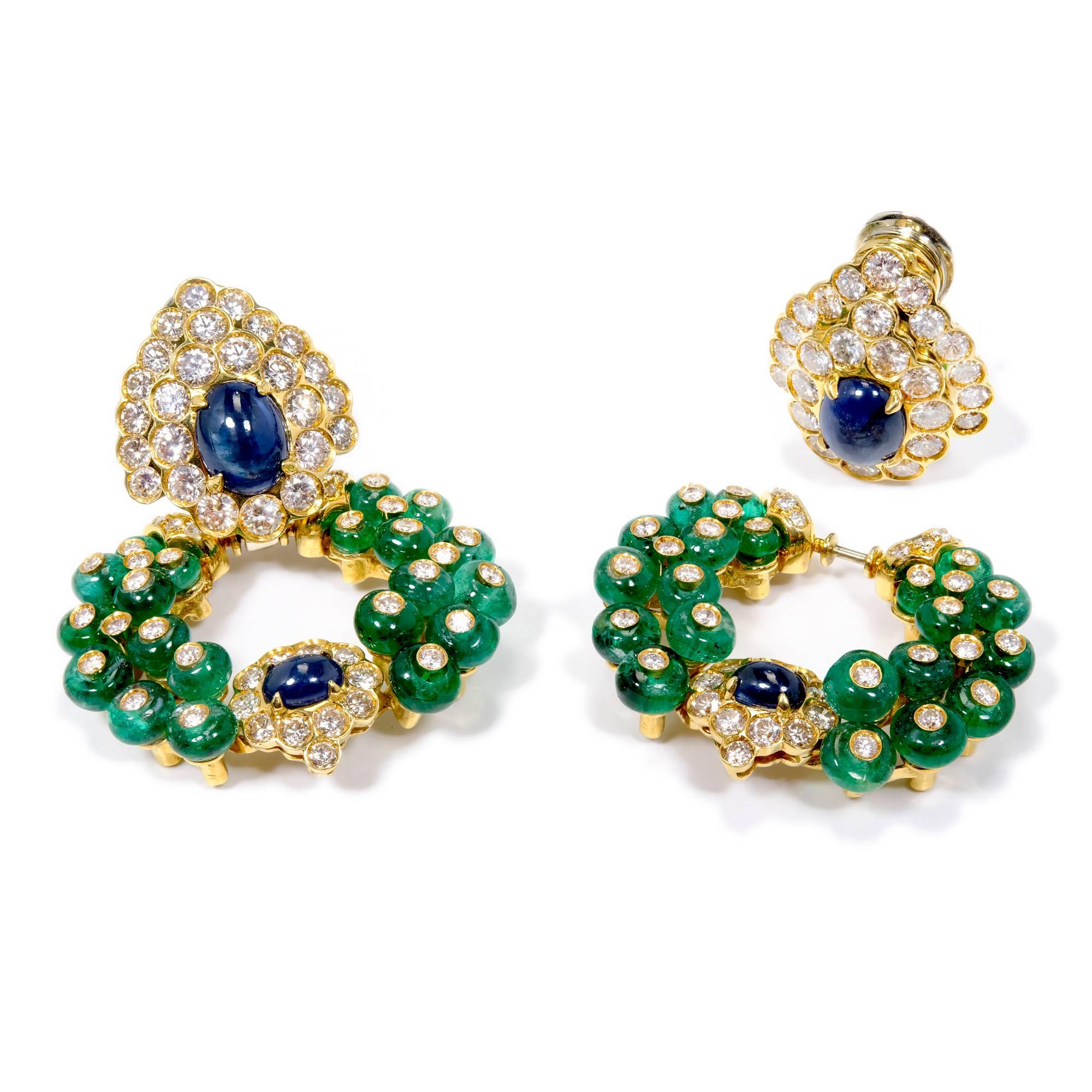 Emerald sapphire diamond dangle day and night earrings by Italian designer Giovane. The sapphire and diamond tops can be worn by themselves or with the emerald sapphire diamond bottoms. The post folds away for non pierced ears and up for pierced.