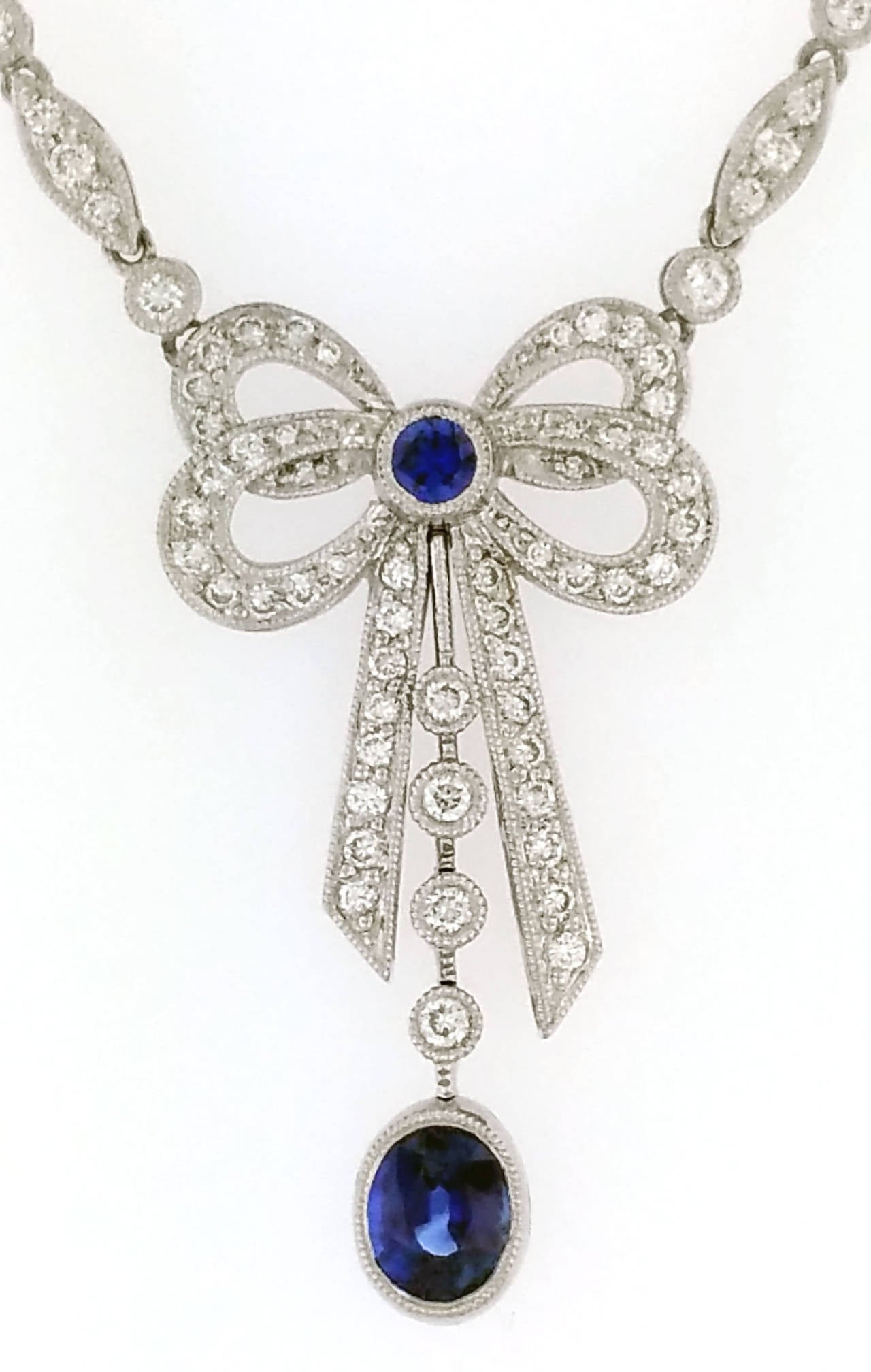 Women's 1.10 Carat Oval Sapphire Pave Round Diamond Platinum Bow Pendant Necklace