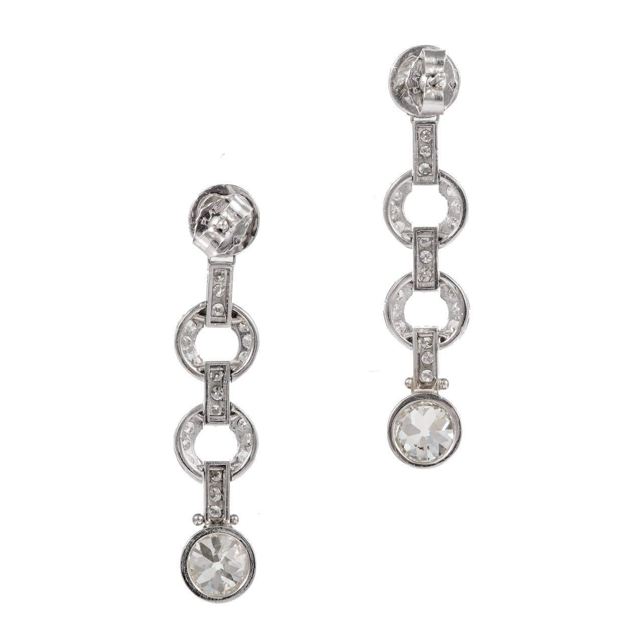 Solid Platinum handmade hinged dangle diamond earrings, set with 4 bright old European cut diamonds and single cut diamonds in the connecting links. 

4 round diamonds approx. total weight 3.25cts, H, VS2 – SI1.
42 round diamonds approx. total