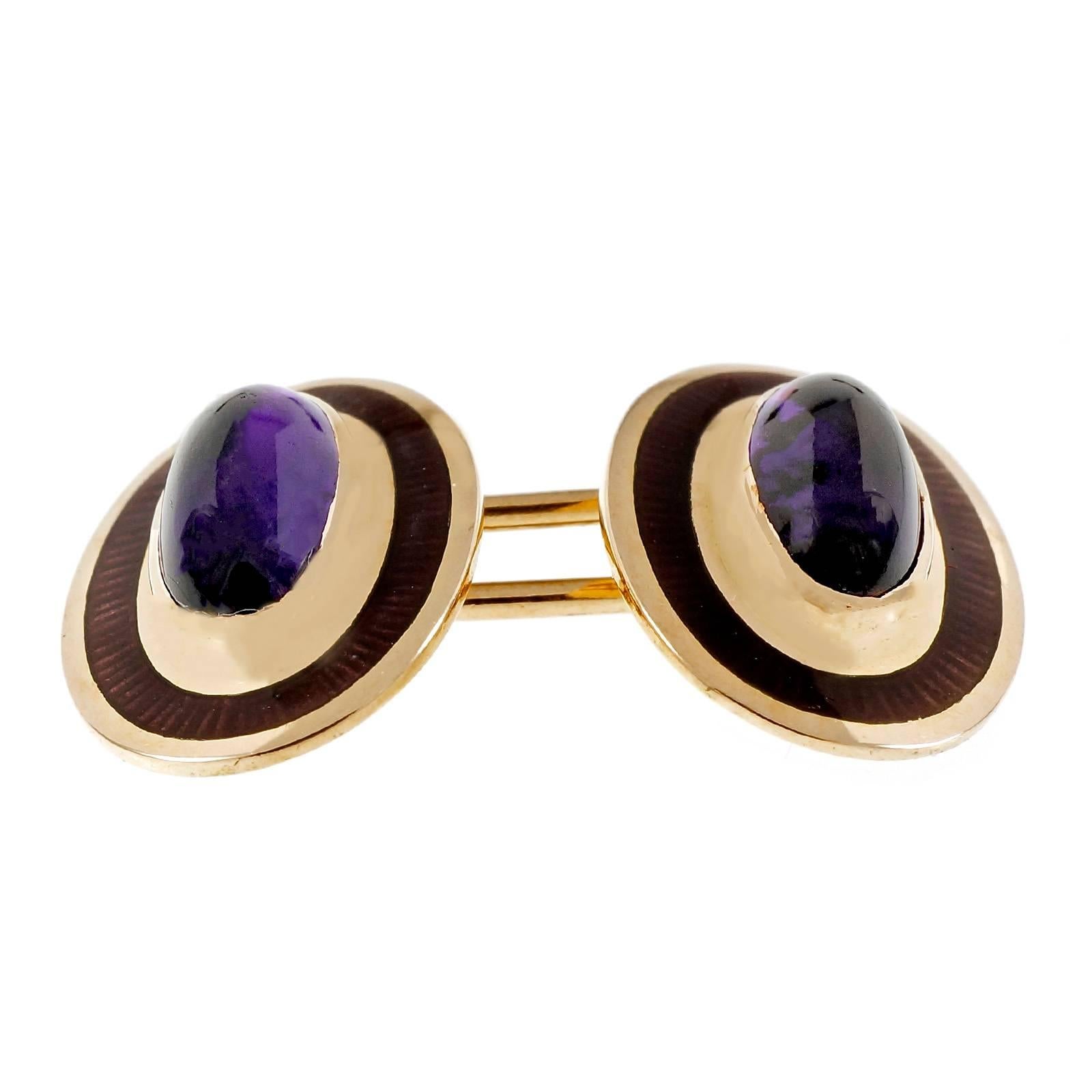 Victorian 1900 double sided 14k yellow gold cuff links with fine genuine natural cabochon Amethyst and purple enamel rim.

4 oval cabochon purple Amethyst, 9.46 x 4.43mm
14k yellow gold
Tested and stamped: 14k
Hallmark: D
9.4 grams
Top to bottom: