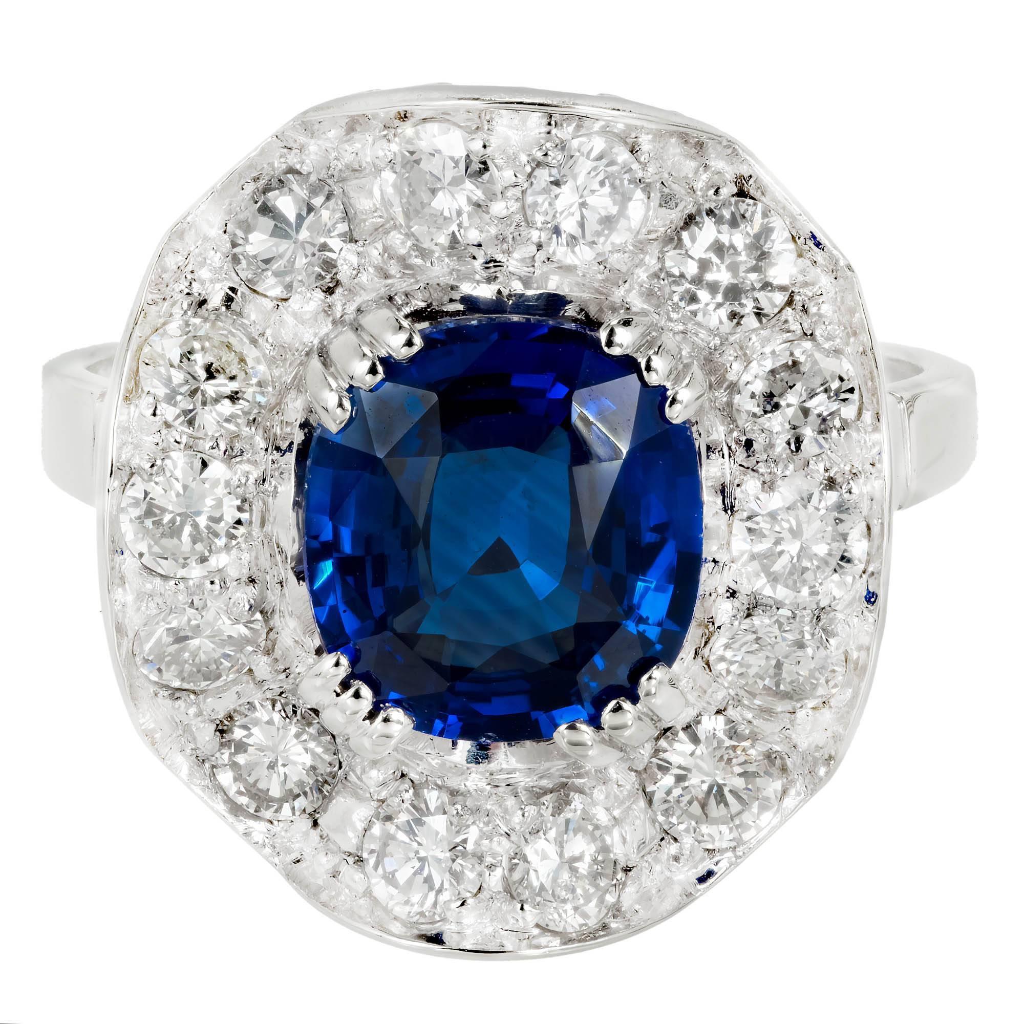 Vintage 1940s sapphire and diamond halo wave design engagement ring. Cushion cut GIA certified center sapphire with a halo of 14 round cut diamonds in a 18k white gold setting. Natural Sapphire, simple heat only. 

18k white gold 
1 cushion blue