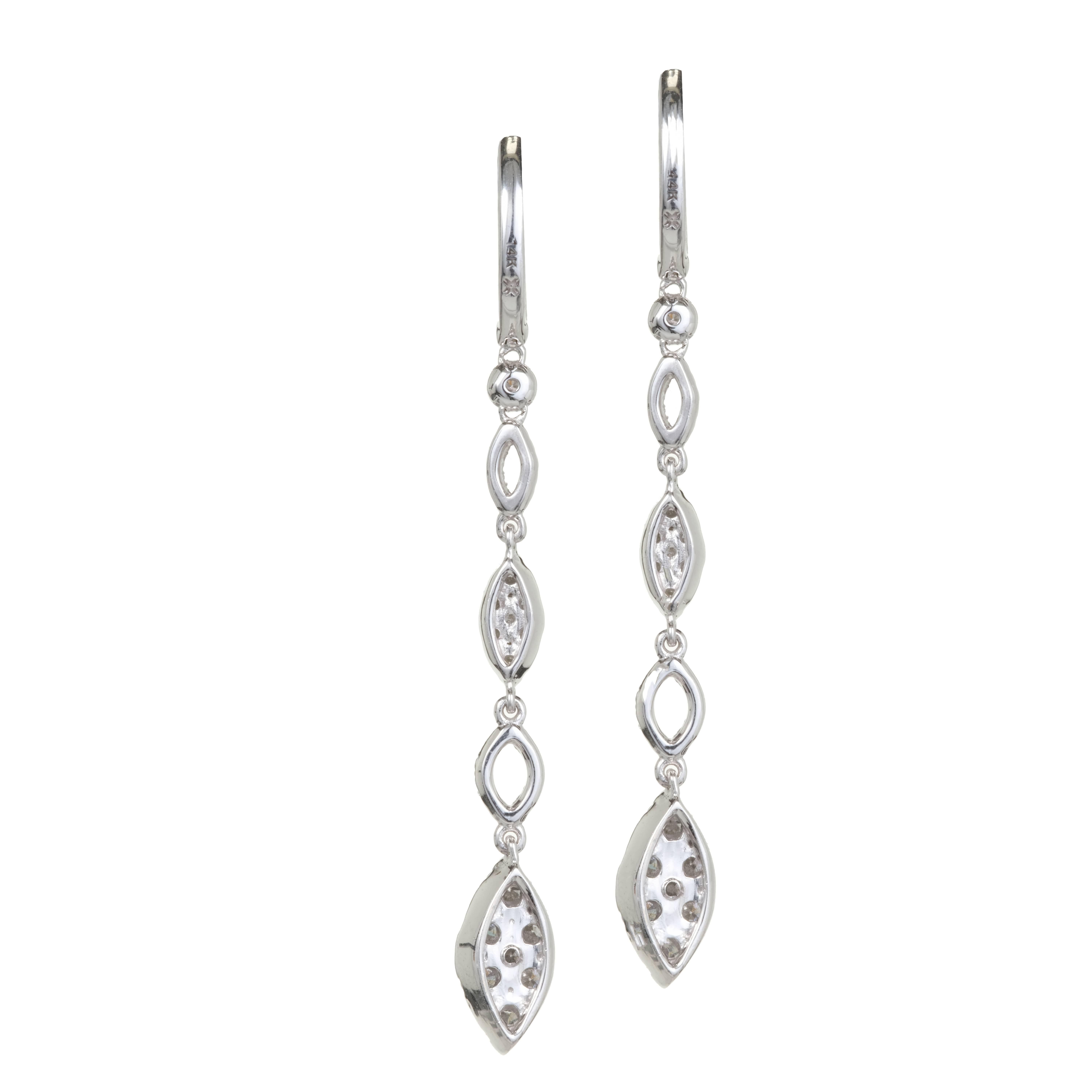 Bright sparkly full cut Diamond dangle drop earrings with hoop tops and 4 dangle sections in 14k white gold.

130 full cut Diamonds, approx. total weight 1.50cts, G, VS2 – SI1
14k white gold
Tested: 14k
4.3 grams
Top to bottom: 50.99mm or 2