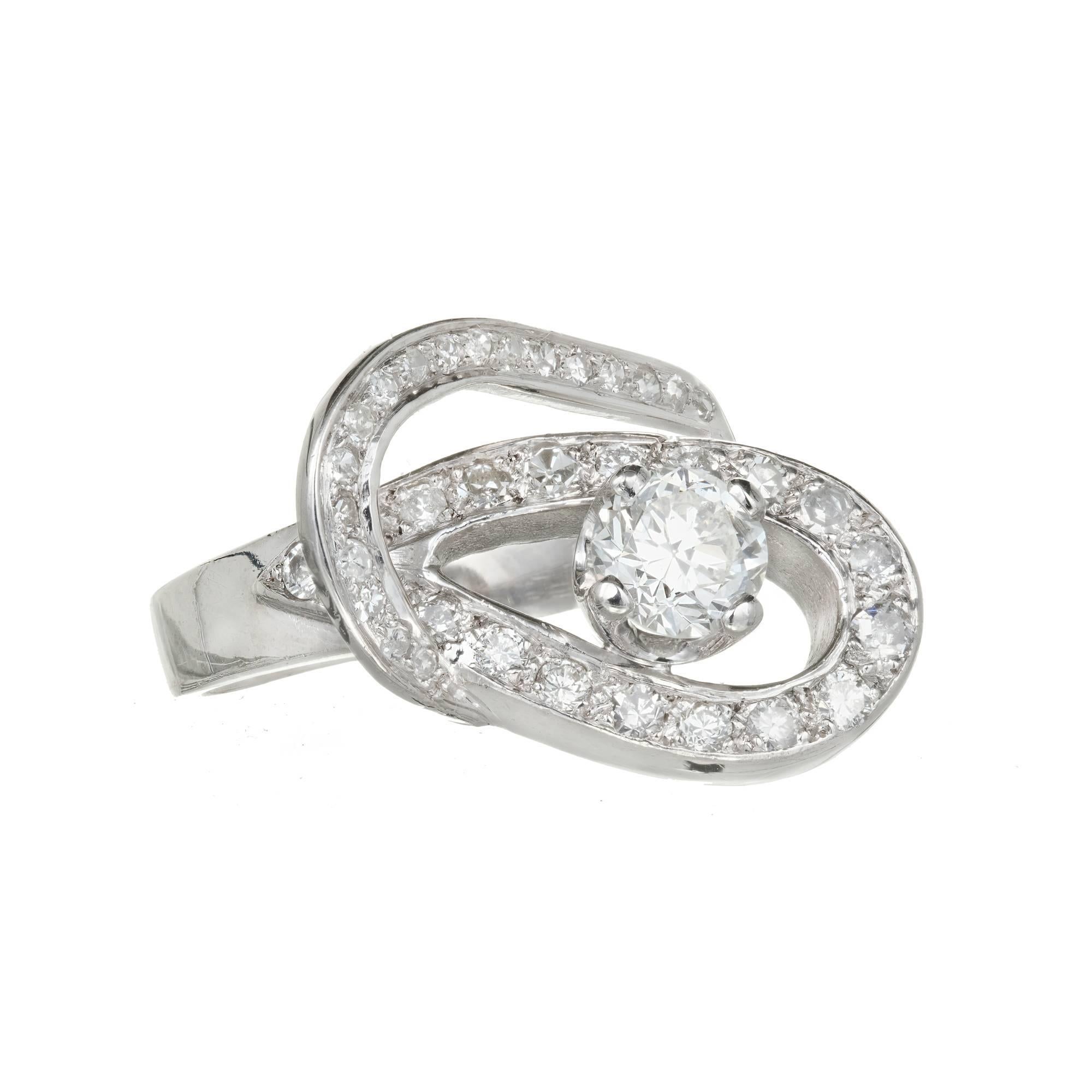 1950's diamond open work double ellipse cocktail ring in a handmade solid Platinum with a transitional cut bright white main stone and Diamond accents.

1 transitional brilliant cut Diamond, approx. total weight .80cts, F – G, SI3, EGL certificate #