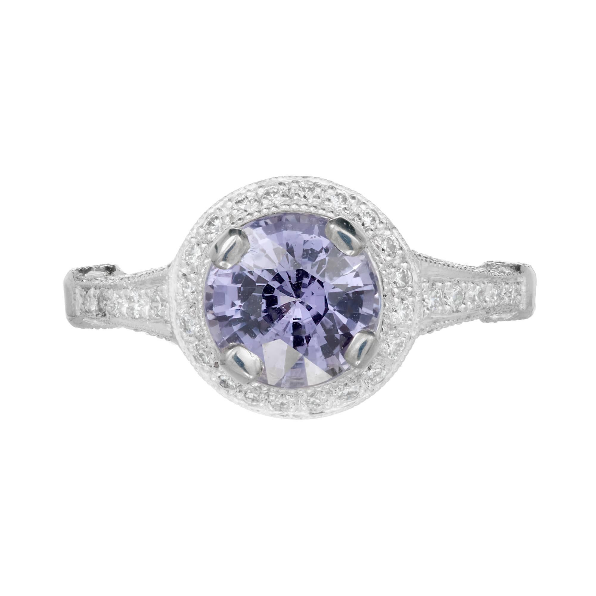 Peter Suchy micro Pavé engagement ring with bright white full cut Diamond halo to enhance a bright violet all-natural GIA certified round Sapphire. 

1 round bright violet Sapphire, approx. total weight 1.71cts, VS, GIA certificate #2183476180
100