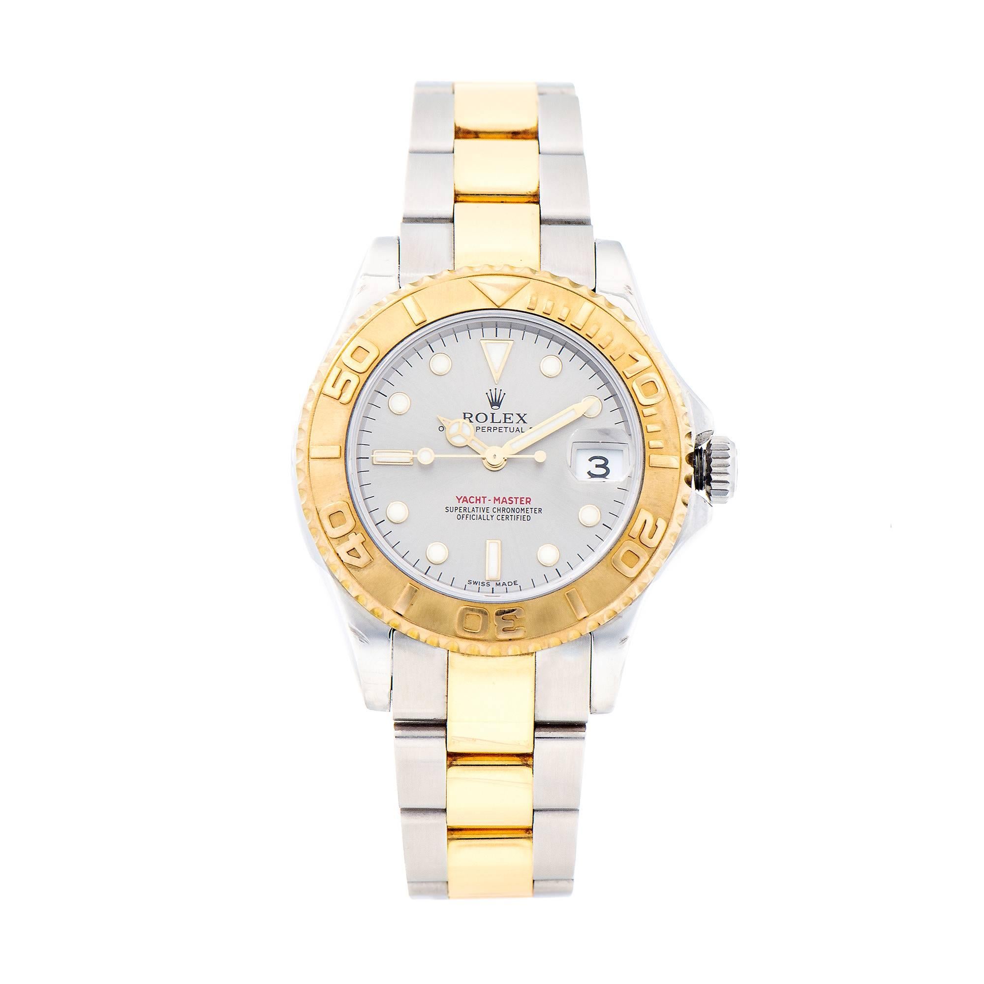 Rolex 2007 Yachtmaster midsize with Platinum colored dial.  Stainless steel and 18k yellow gold case and Oyster band. All factory original with factory sticker still on the case back. 18k Yellow Gold bezel. 

 Width without crown: 35mm 
 Width with