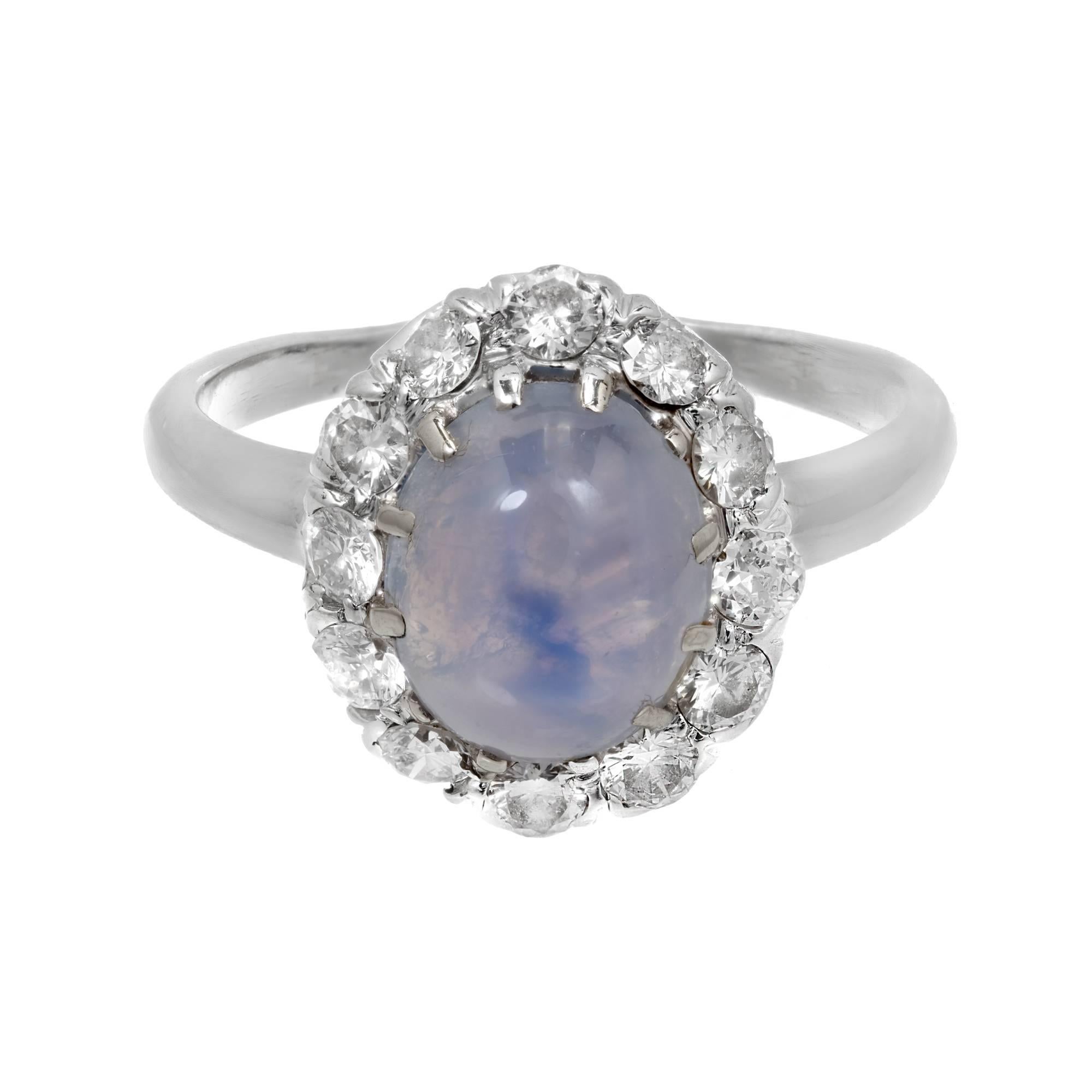 Vintage 1950-1960 GIA certified natural light blue star Sapphire ring with a well-defined star Sapphire surrounded by a halo of bright sparkly full cut Diamonds. GIA certificate# 2181587849

14k white gold
1 oval light blue cabochon Star Sapphire,