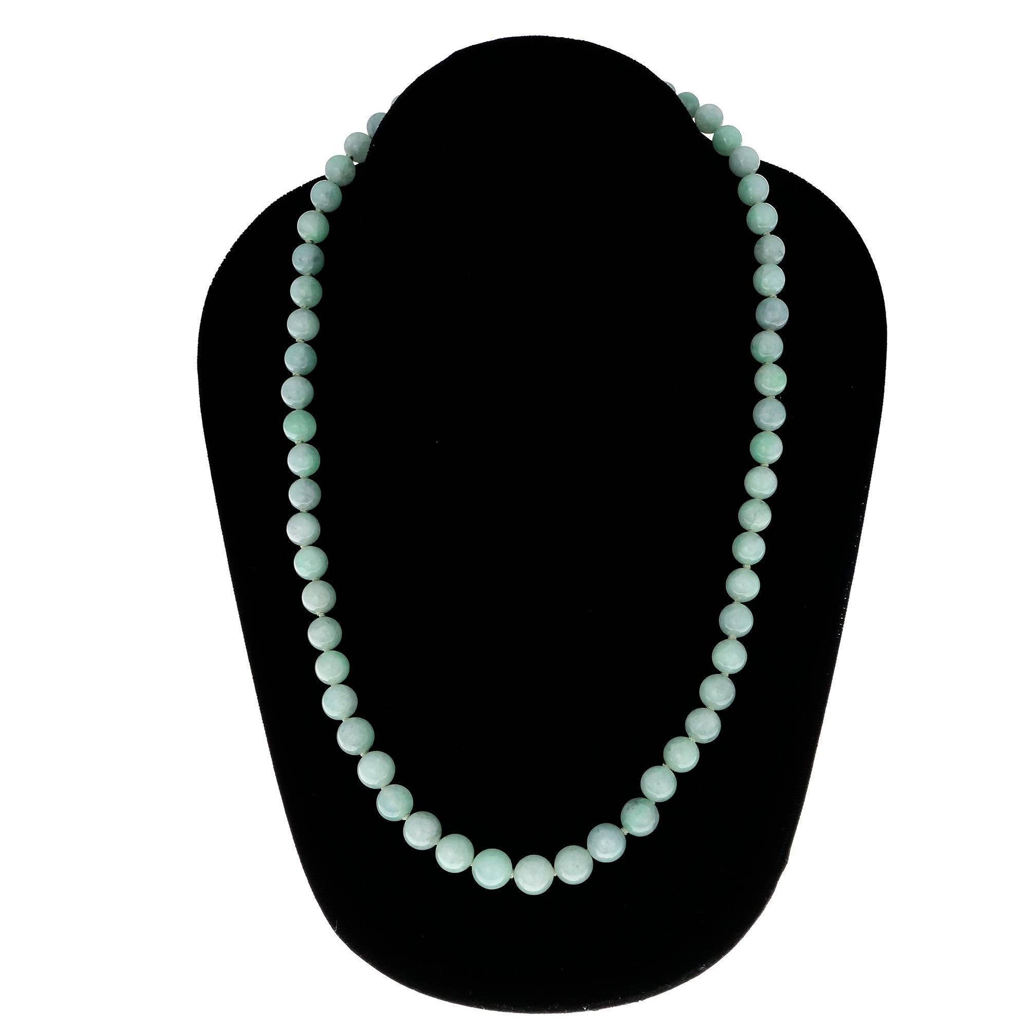 Bright translucent GIA certified natural Jadeite Jade bead necklace of light green color natural Jade. 14k yellow gold catch. Certified by the GIA as natural untreated translucent Jadeite Jade. 

14k yellow gold
60 round green Jadeite Jade beads,