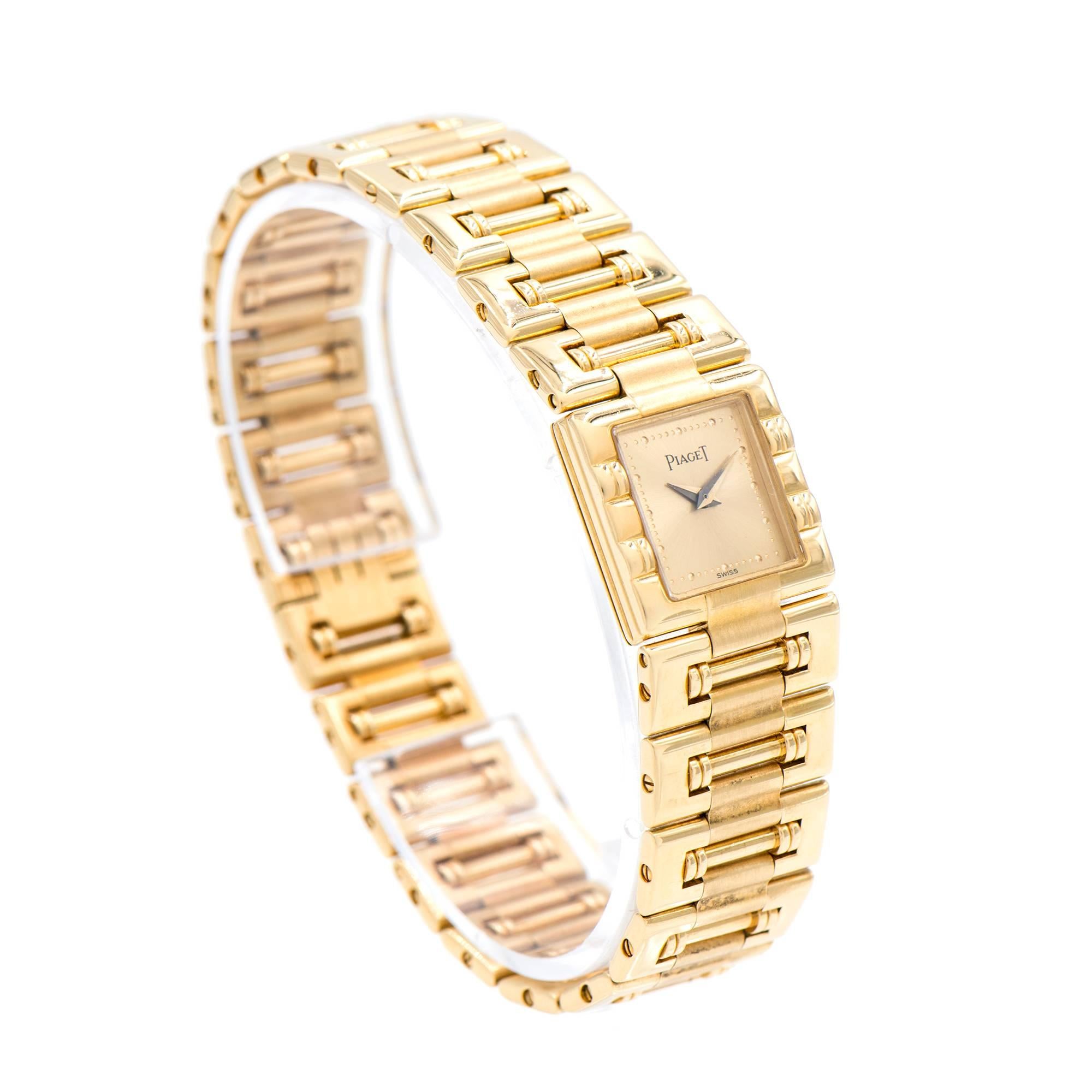 Beautiful sleek design 18k yellow gold ladies Piaget Dancer 15317 quartz with no crown showing push button back set.

Length: 7 inches – can be shortened 
Length: 17mm 
Width: 17mm 
Band width at case: 17mm 
Case thickness:5mm 
64.9 grams 
Crystal: