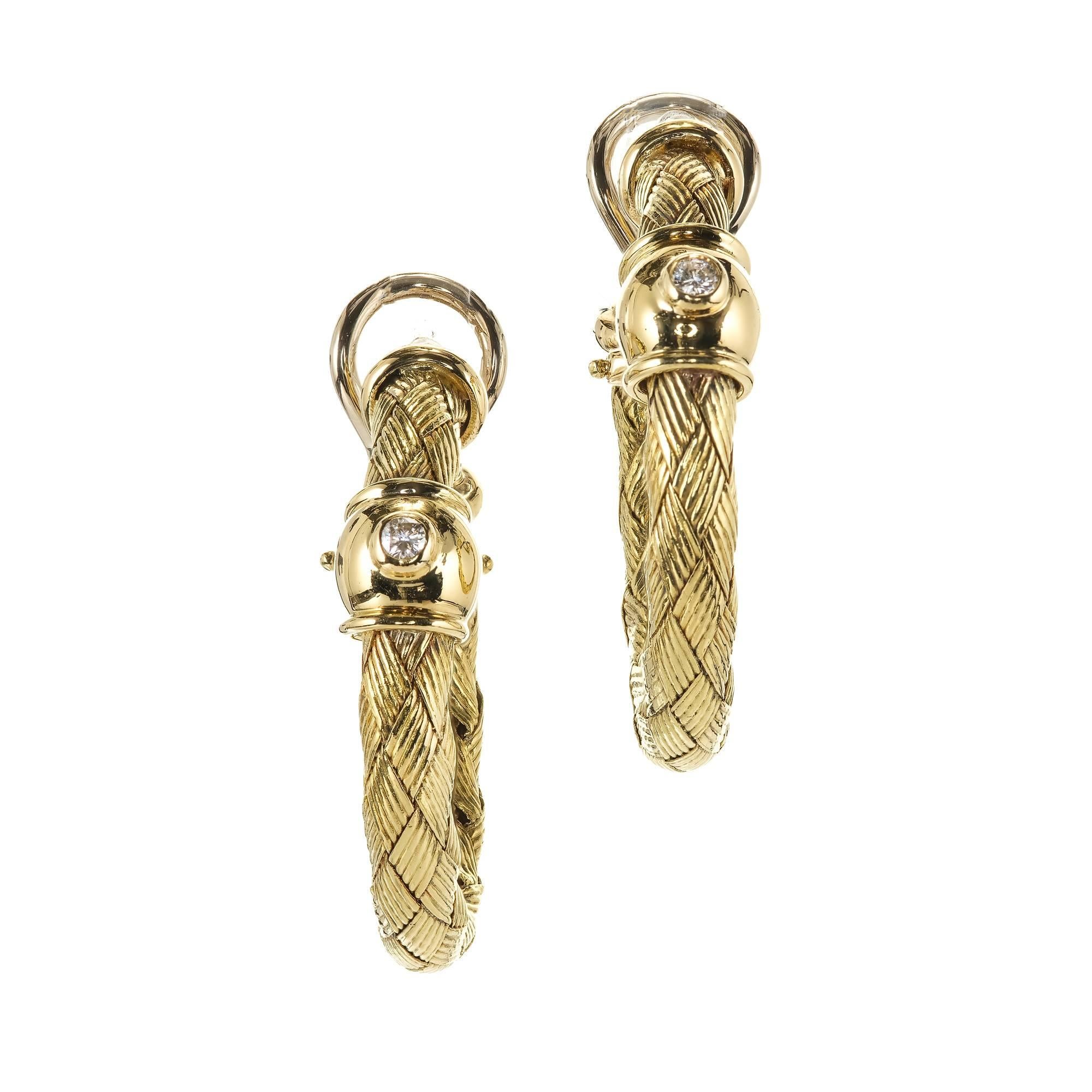 Solid 18k yellow gold braided diamond hoop earrings made in Italy. Post and clip tops. 

2 round Diamonds, approx. total weight .08cts, H, VS2
18k yellow gold
Tested and stamped: 18k
Hallmark: Italy
15.4 grams
Top to bottom: 32.39mm or 1.28