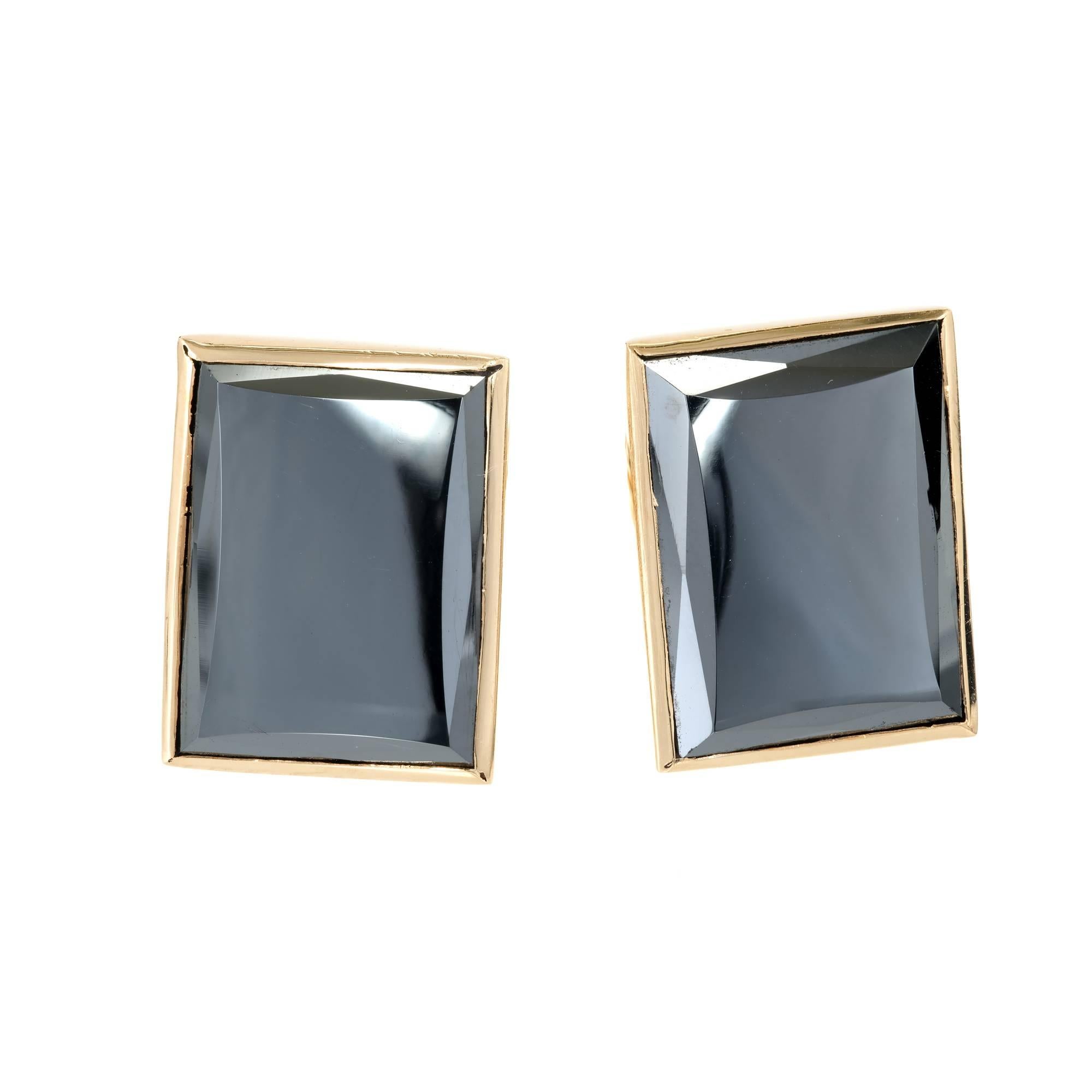 Mid-century vintage 1950’s rectangular Hematite cufflinks in 14k yellow gold. 

2 rectangular Hematite, 18.97 x 14.28 x 2.58mm
14k yellow gold
15.2 grams
Tested and stamped: 14k
Hallmark: U.S. Pat 24.72958
Top to bottom: 16.11mm or .63 inch
Width: