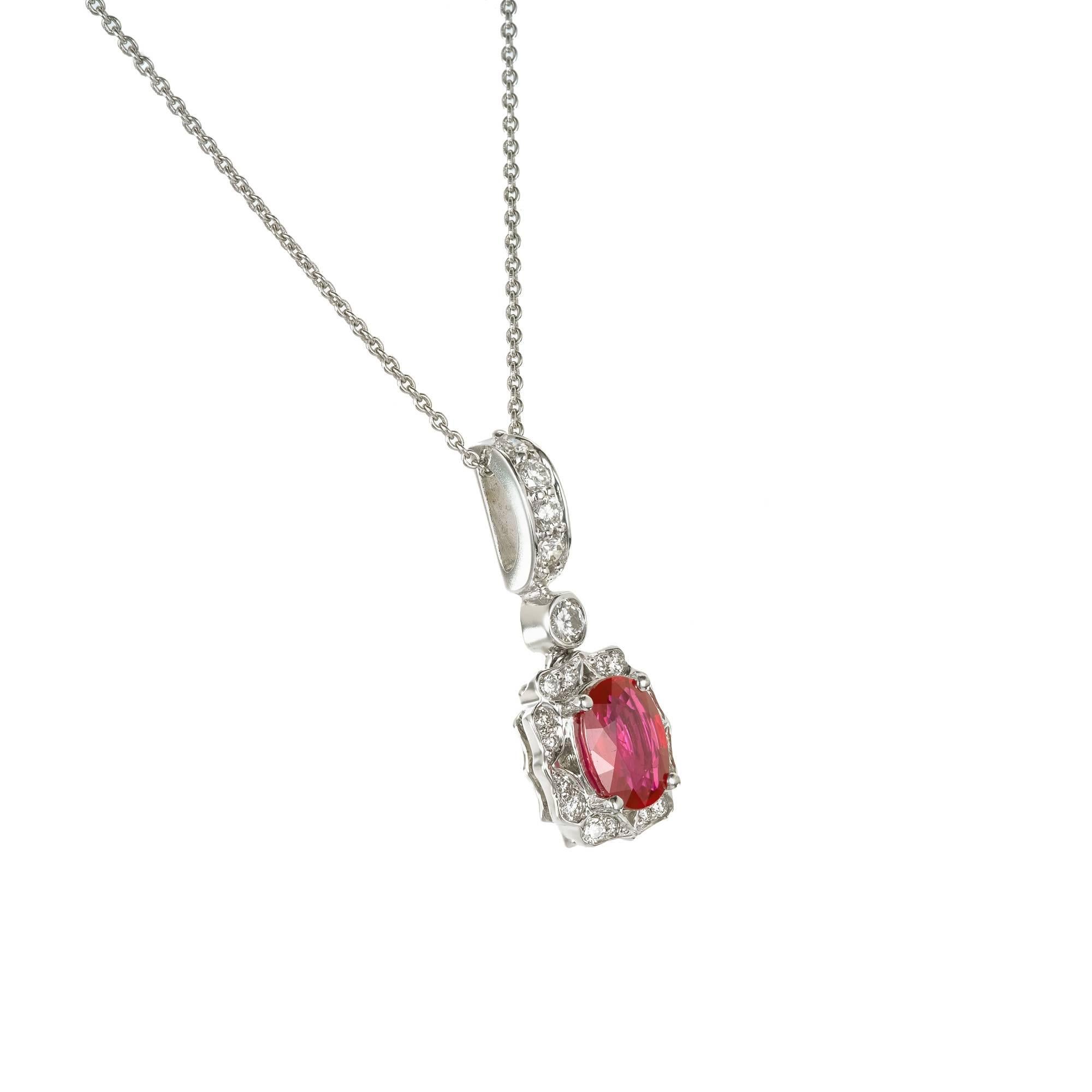 .90 Carat Oval Bright Red Ruby Diamond Gold Pendant Necklace 

1 oval bright red Ruby, approx. total weight .90cts, SI
21 round Diamonds, approx. total weight .25cts, G, VS
18k white gold
4.1 grams
Tested and stamped: 18k
Hallmark: Err Top to