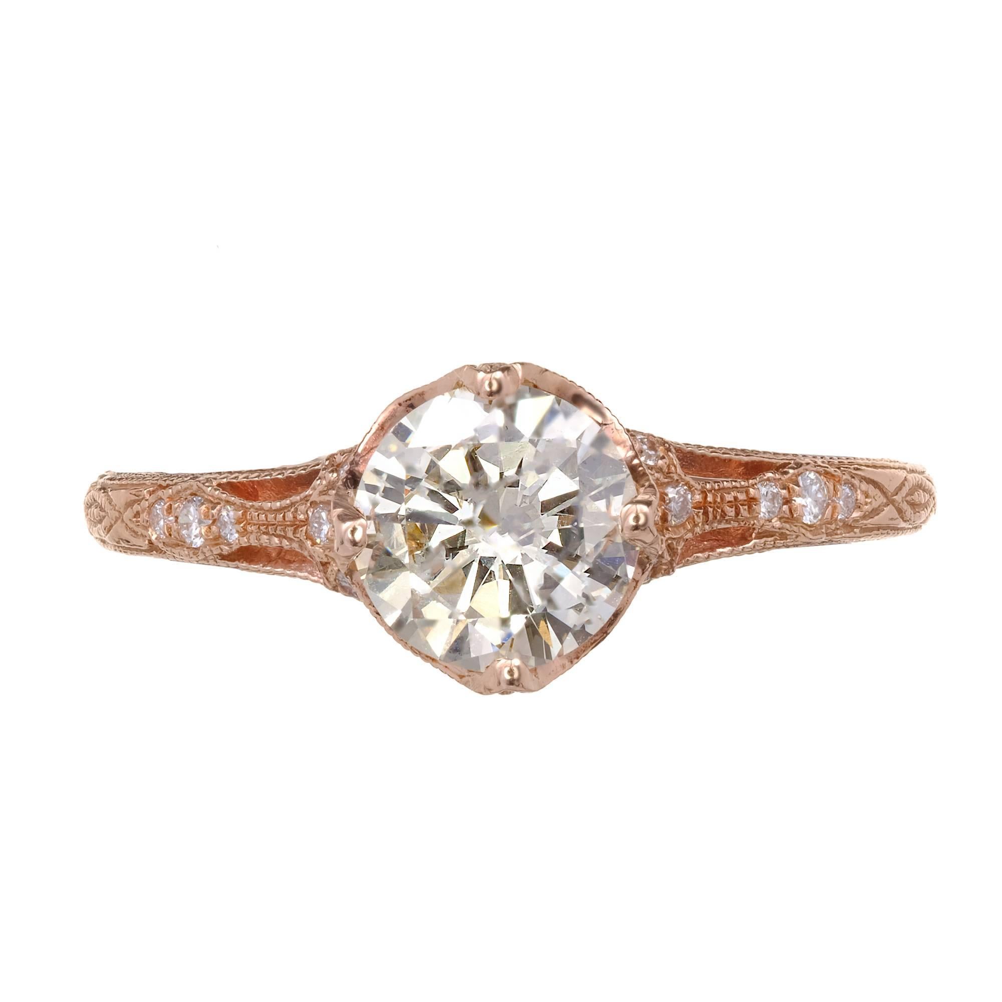 Peter Suchy antique inspired filigree and hand engraved engagement ring in 14k rose gold setting, with an transitional cut diamond. Bright and warm very light yellow S to T color.

1 round diamond, approx. total weight .98cts, S – T, SI1, GIA