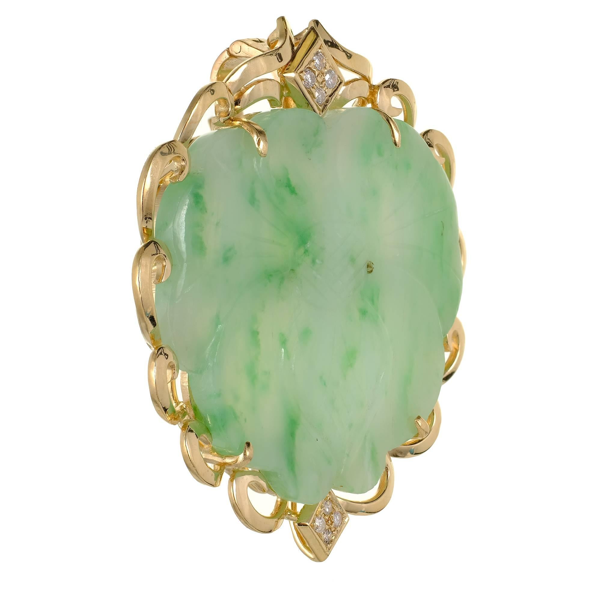 GIA Certified Natural Jadeite Jade mottled green and diamond enhancer pendant brooch combination in a handmade 14k gold frame. Mottled green color carved Jade. Chain not included.

1 pierced carved mottled green Jadeite Jade, 33.05 x 24.3 x 2.75mm,