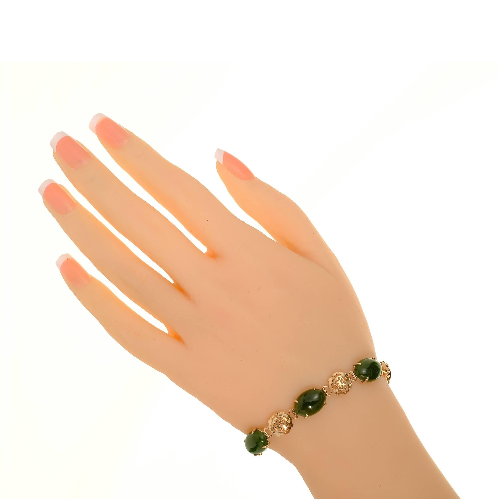 Vintage 1940-1950 18k rose gold bracelet with 6 natural well polished Nephrite Jadeite Jade cabochons.

5 oval cabochon Nephrite Jadeite Jade, 14.06 x 9.89 x 4.29mm
18k rose gold
Tested: 18k
Stamped: K18
9.4 grams
Length: 7 inches – Width: 9.87mm –