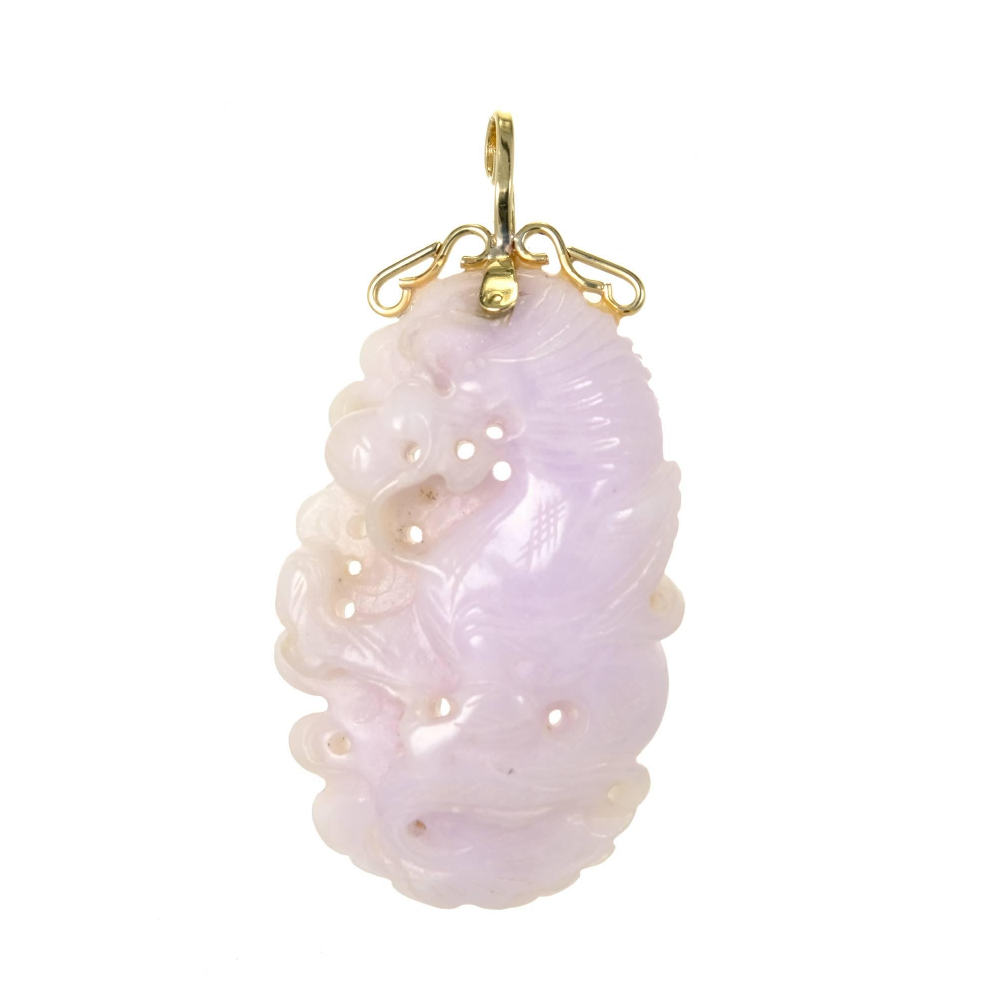 Large beautifully carved and pierced GIA certified natural Jadeite Jade pendant with a handmade 14k gold top.

1 pierced carved light purple Jadeite Jade, 50.33 x 31.31 x 3.32mm, GIA certificate #2185637096
14k yellow gold
34.51 grams
Tested and