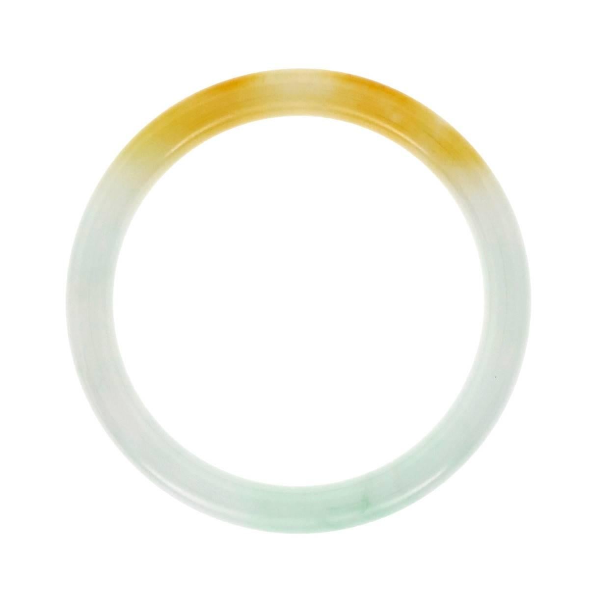 Natural Jadeite Jade blended white, brown and green color GIA certified undyed and untreated. Inside circumference 8.25 inches and will fit over most hands. Bright translucent Jade.

1 variegated light brown and green Jadeite Jade bangle bracelet,
