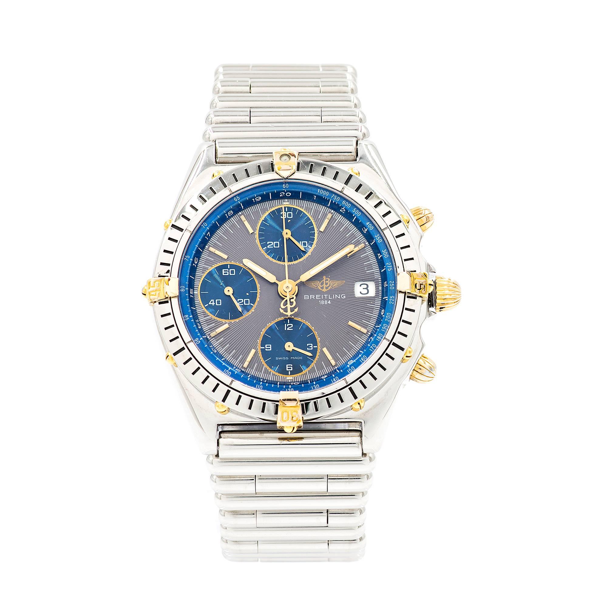 Breitling men’s Chronograph Automatic Date wristwatch in 18k yellow gold and steel with a steel Rolo band and a two tone grey and blue dial. Restored to almost as new condition.

18k yellow gold
104.9 grams
Length: 8 inches – can be shortened and