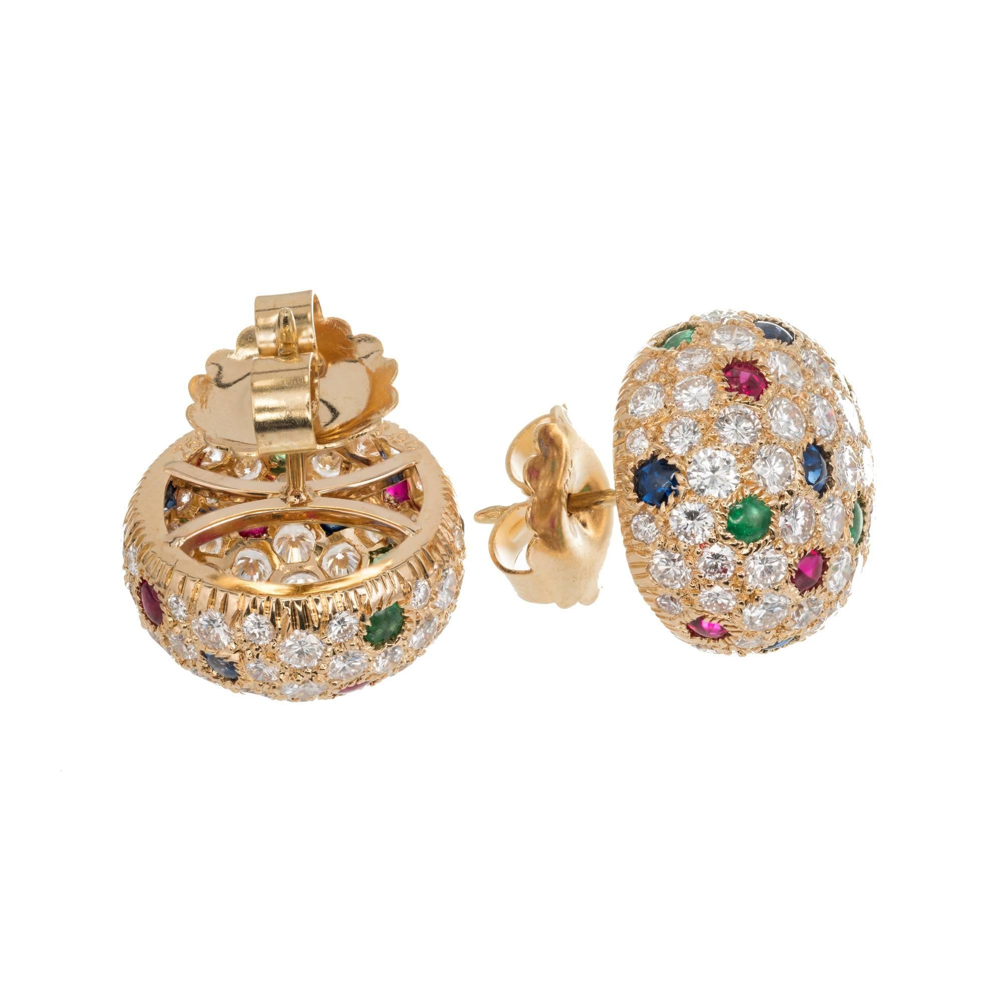 Cartier Panthere Dome Earrings. 18k Yellow Gold with pave set fine diamonds, cabochon emeralds, rubies and sapphires. 

130 Ideal full cut round diamonds, E to F VVS- VS approximately 6.00 carats
14 fine gem bright blue cabochon cut sapphires, VS