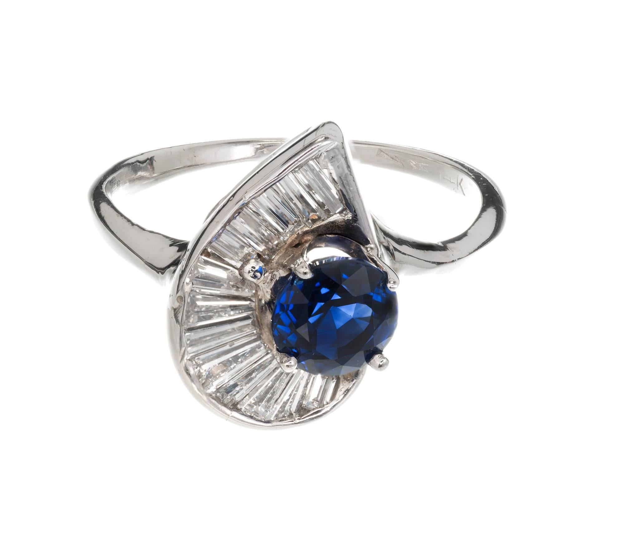 Vintage mid-century 1950s natural no heat blue Sapphire and Baguette Diamond swirl ring. 14k white gold setting.

1 round blue Sapphire, approx. total weight .98cts, no heat, GIA certificate #1182361602
13 Baguette Diamonds, approx. total weight