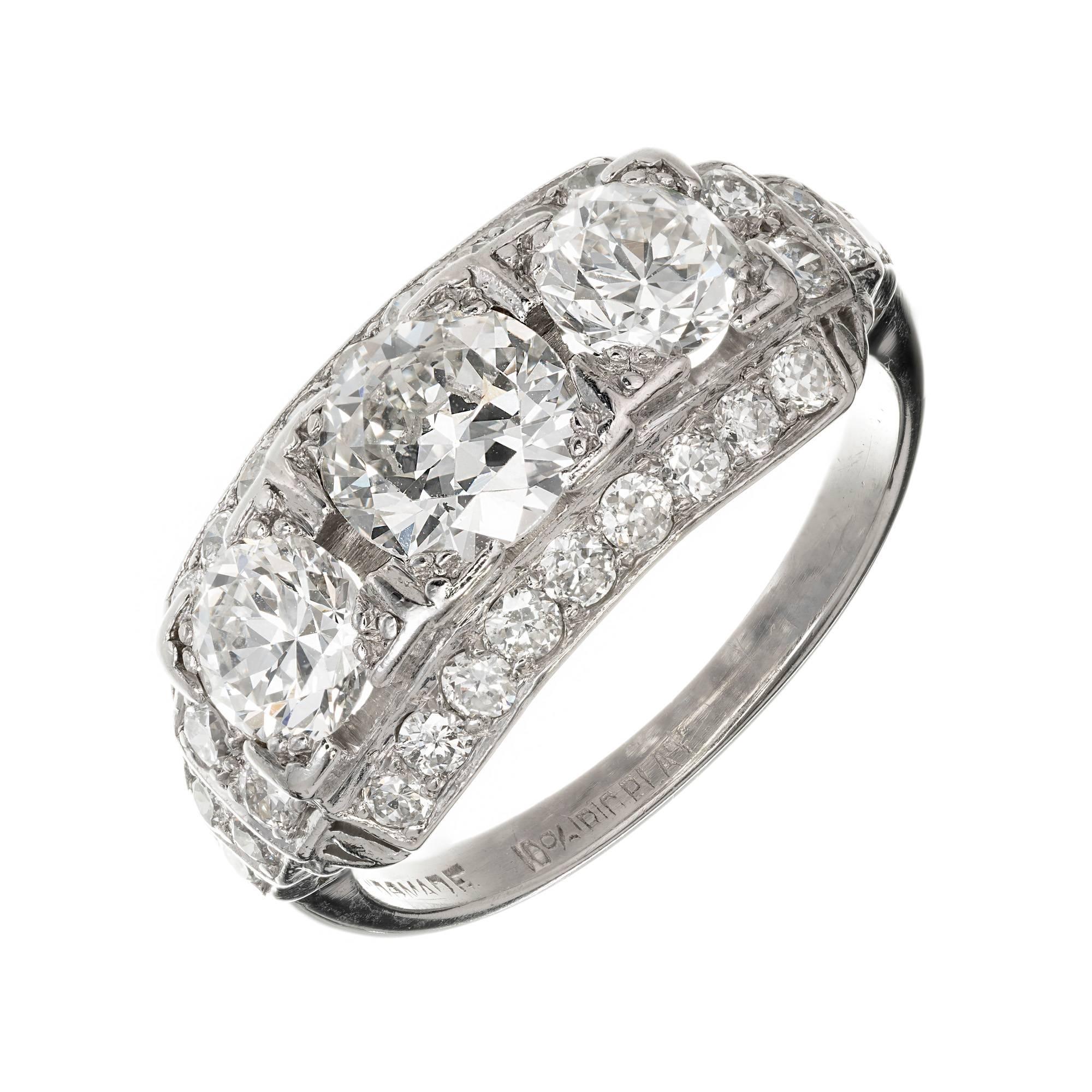 Art Deco 1930s three-stone Diamond ring with transitional cut bright sparkly Diamonds in a handmade Platinum setting. EGL certified.

1 transitional cut Diamond, approx. total weight .87cts, H – I, SI1, EGL certificate # US313879003D
2 transitional