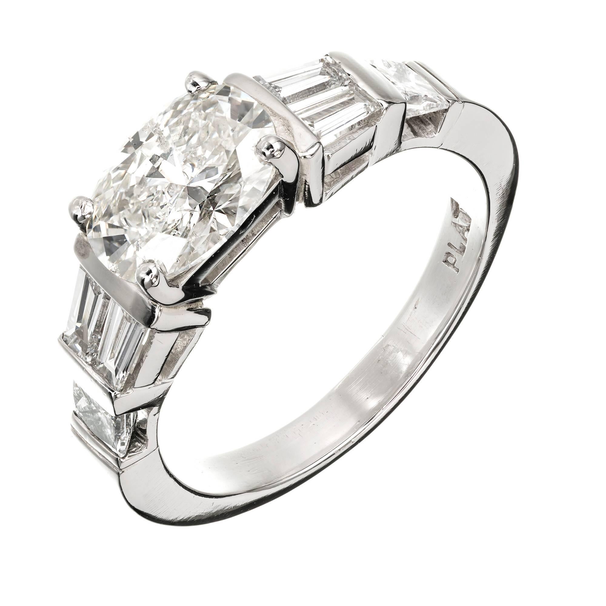 Peter Suchy oval Diamond engagement platinum ring. Solid Platinum with Princess cut and Baguette cut Diamond accents. Bar set side stones compliment the bright sparkly Ideal cut oval center Diamond set East to West to finish the one of a kind look.