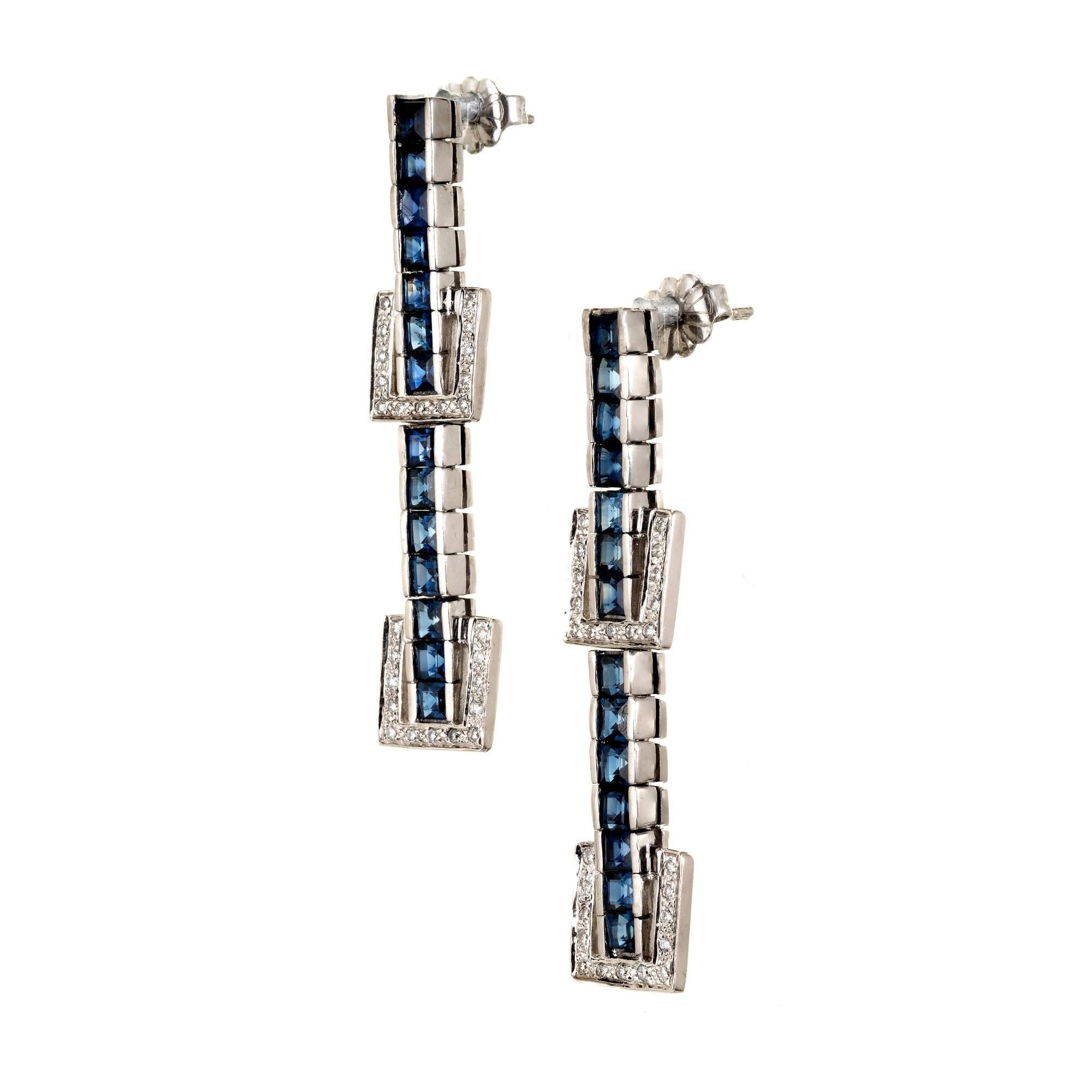 Delightful buckle design dangle earrings in 14k white gold with square bright blue Sapphires and full cut Diamonds.

14 square blue Sapphires, approx. total weight 2.00cts
52 full cut Diamonds, approx. total weight .20cts, H, VS – SI
14k white