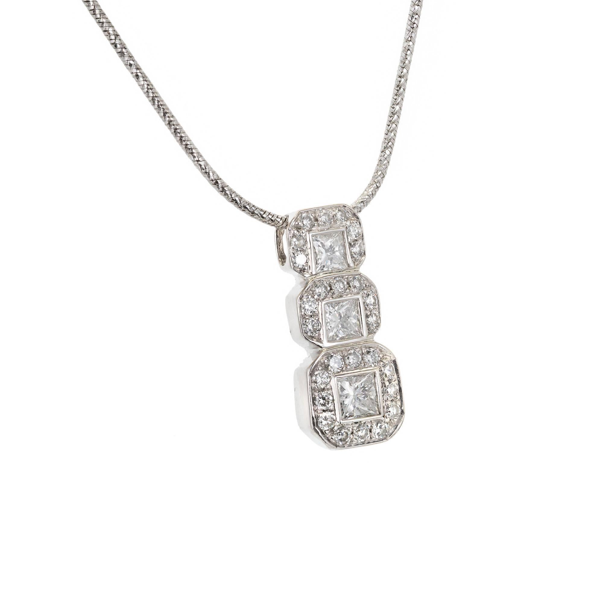 Princess and round full cut Diamond pendant Necklace on an 18-inch chain. All 14k white gold.

3 Princess cut Diamonds, approx. total weight .37cts, H, SI, 2.3 – 3.3mm
26 full cut Diamonds, approx. total weight .13cts, H, SI
14k white gold
Tested:
