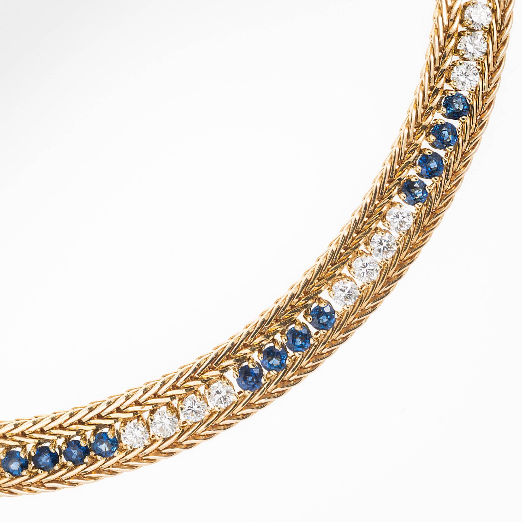 Vintage 1950's handmade diamond and sapphire necklace. 18k yellow gold necklace with wheat chain sides and extra fine blue Sapphires and white Diamonds set all around in groups of four. 15.5 inches

60 round full cut Diamonds, approx. total weight
