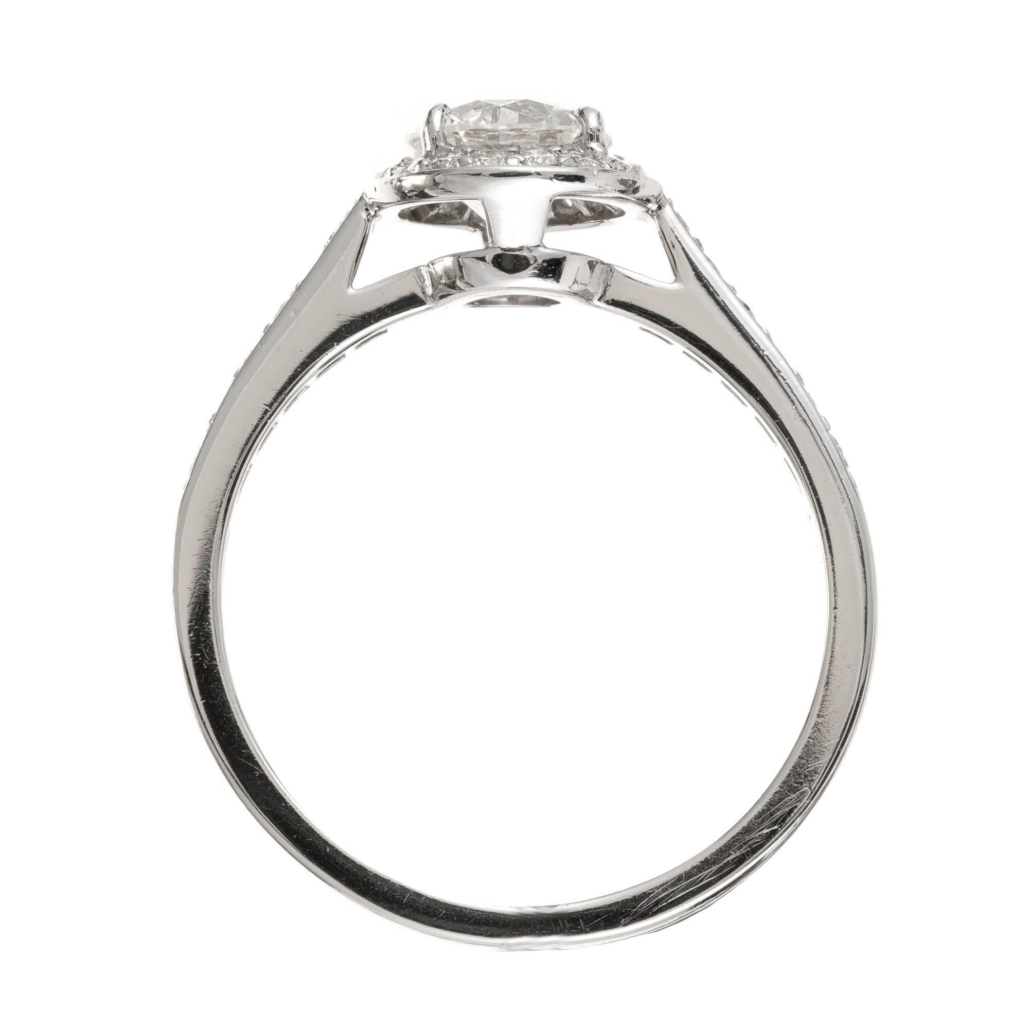 Tiffany & Co .76 Carat Diamond Halo Platinum Engagement Ring In Good Condition In Stamford, CT