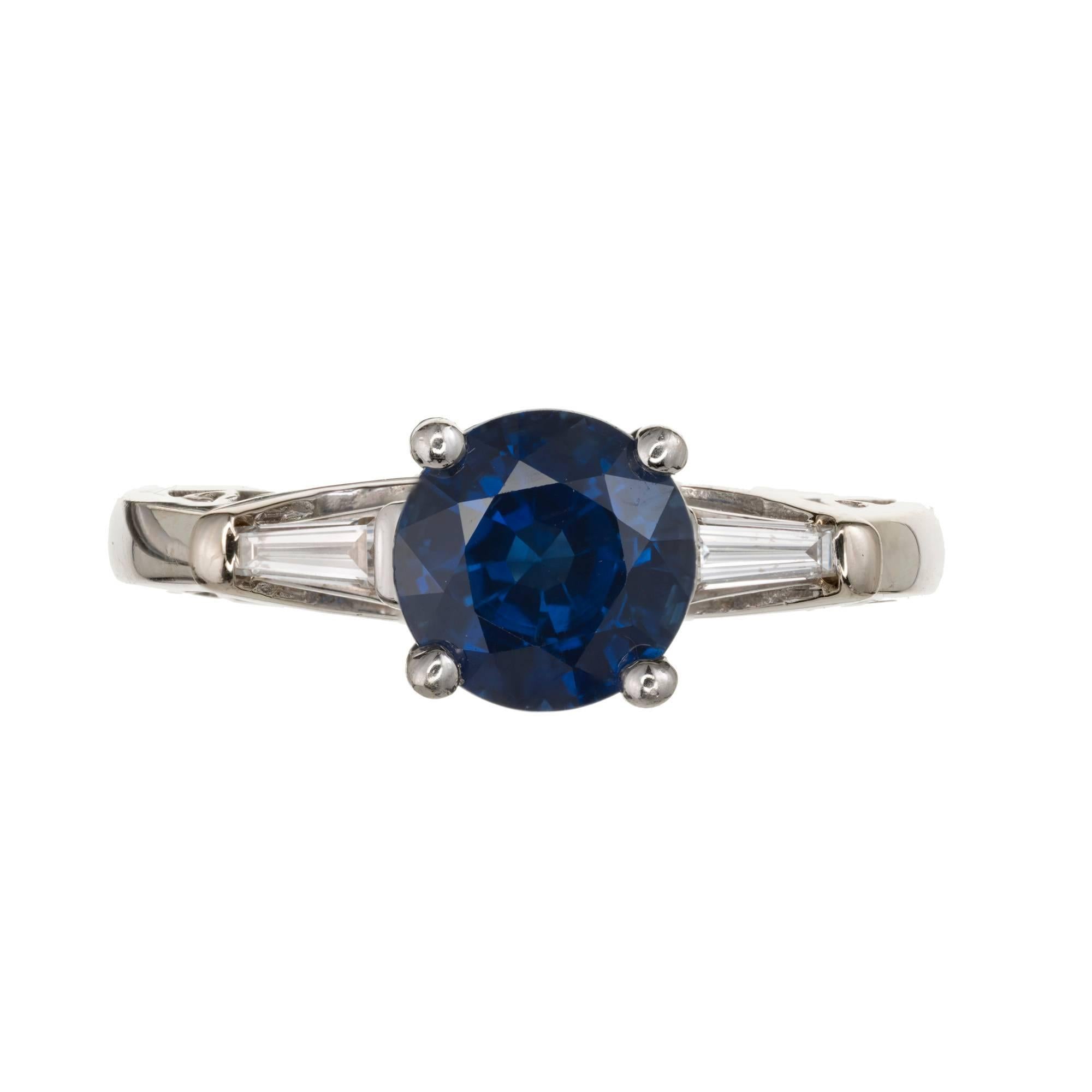 Royal blue Sapphire diamond three-stone engagement ring 2.37ct round simple heat only and certified natural corundum. Beautiful baguette ring by Del Co. 

14k white gold
1 round Royal blue Sapphire, approx. total weight 2.37cts, natural Sapphire,