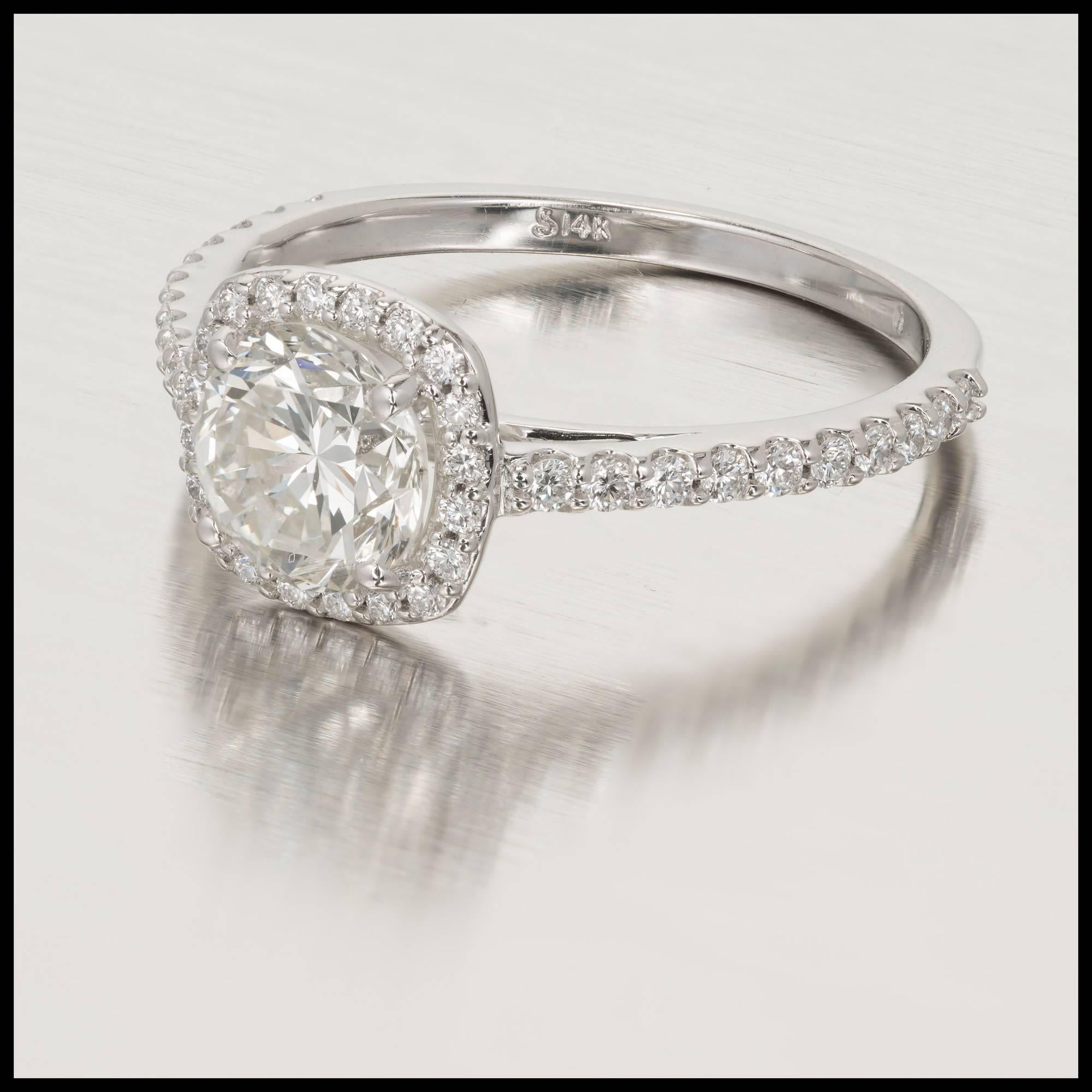 Peter Suchy cushion shape halo style engagement ring set with a bright transitional cut Diamond round center and bright white full cut Diamonds around. The ring is designed to fit flush next to a wedding band.  EGL certified.

1 round transitional