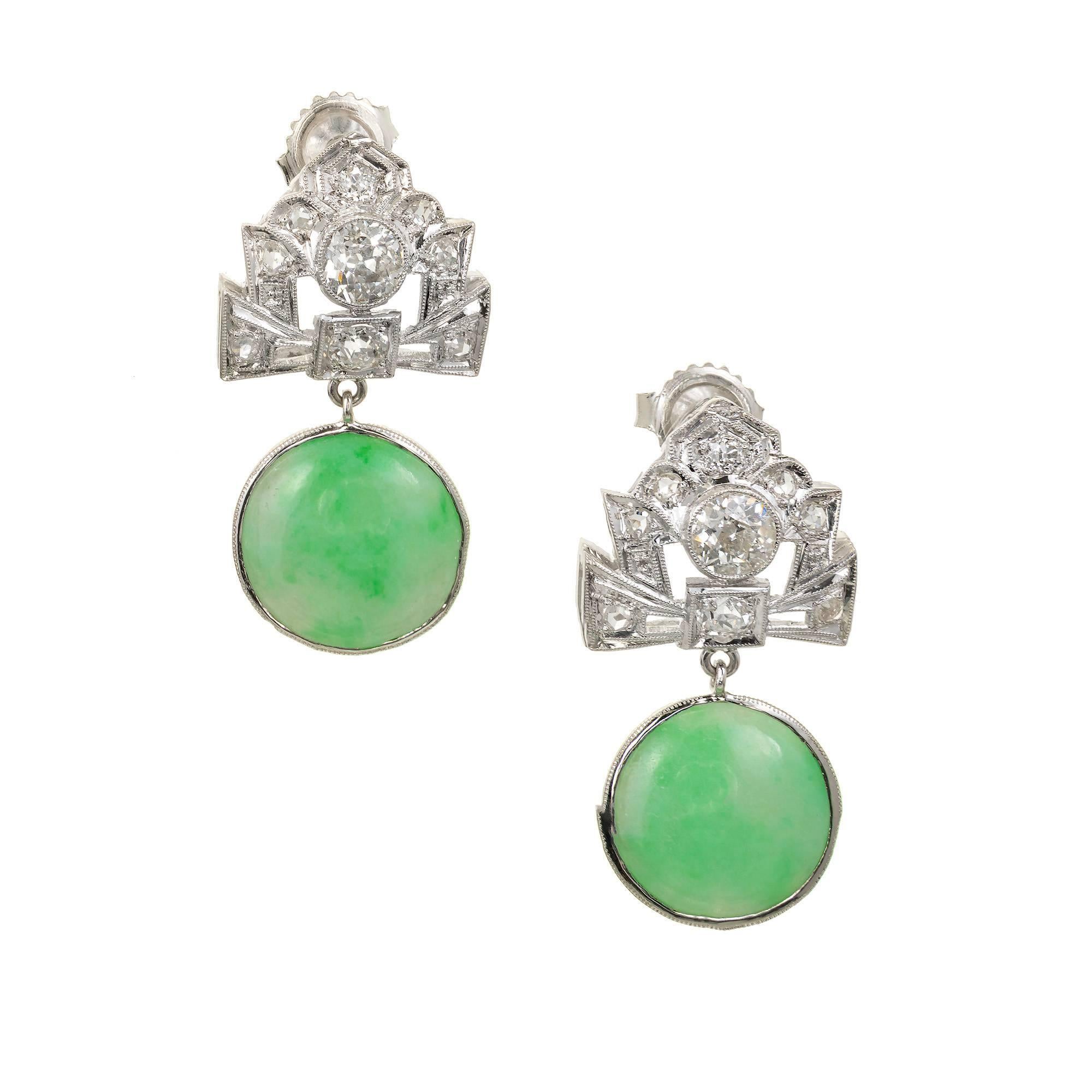 Original jade and diamond Art Deco dangle earrings circa 1920s with round natural Jadeite Jade dangles over 5.00cts each. Both GIA certified natural and untreated. The tops are handmade in Platinum with an Art Deco bow design and bright old cut
