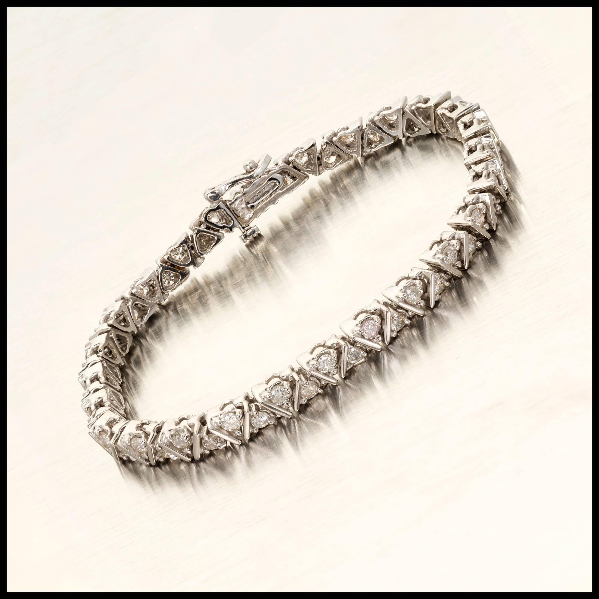 Estate 2 row design 14k white gold Diamond bracelet. Built in secure catch and side lock safety.

52 round full cut Diamonds, approx. total weight 2.00cts, I, SI1 – I1
14k white gold
18.0 grams
Tested and stamped: 14k
Length: 7 inches – Width: