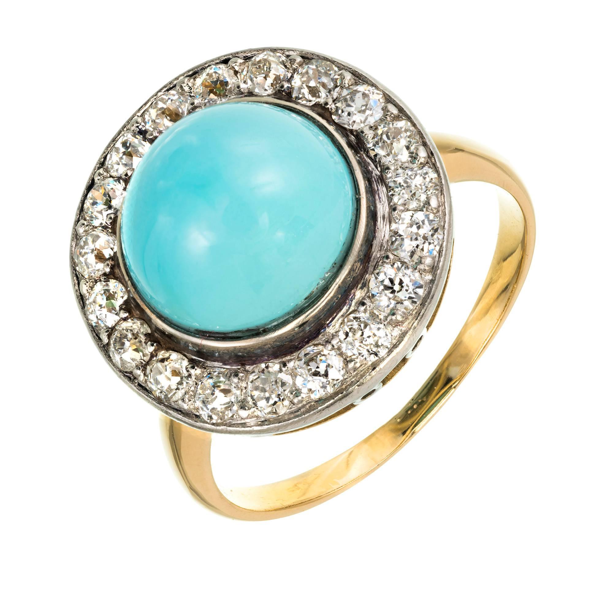 Natural untreated Persian blue Turquoise round cabochon ring circa 1930. Bright shiny high dome Turquoise surrounded by bright sparkly old European cut Diamonds in a handmade Platinum top on a 14k yellow gold ring.

1 round cabochon greenish blue