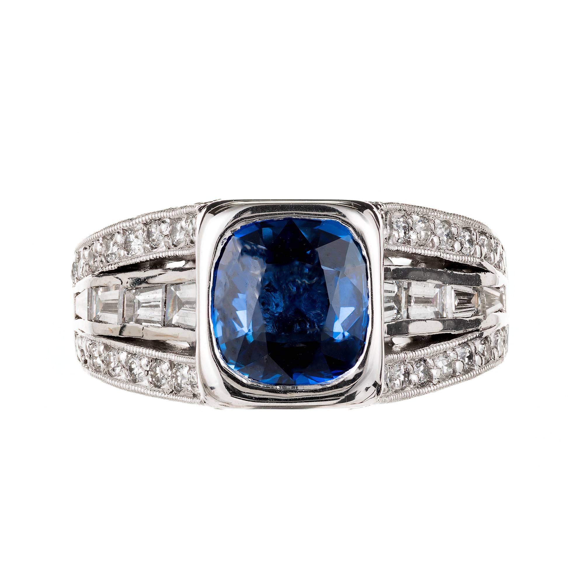 Peter Suchy platinum engagement ring set with a cushion cut bright blue GIA certified natural Sapphire no heat and no enhancements in a 3 row Baguette and round Diamond setting.

1 cushion blue Sapphire, approx. total weight 1.98cts, VS2 – SI1,