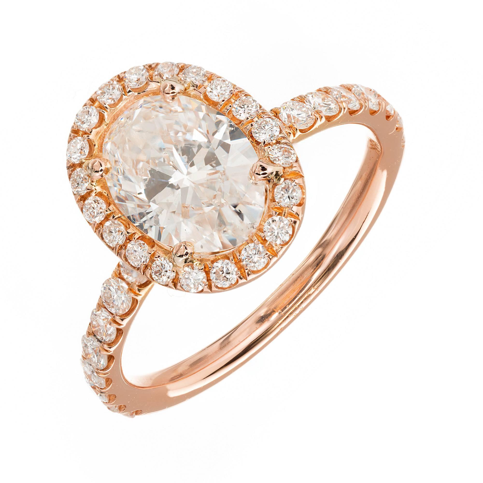 Peter Suchy Micro pave set diamond halo engagement ring with an Ideal cut GIA certified oval center diamond in a 18k rose gold setting. 

1 oval diamond, approx. total weight 1.23cts, E, SI2, GIA certificate # 2165674595
34 round full cut diamonds,