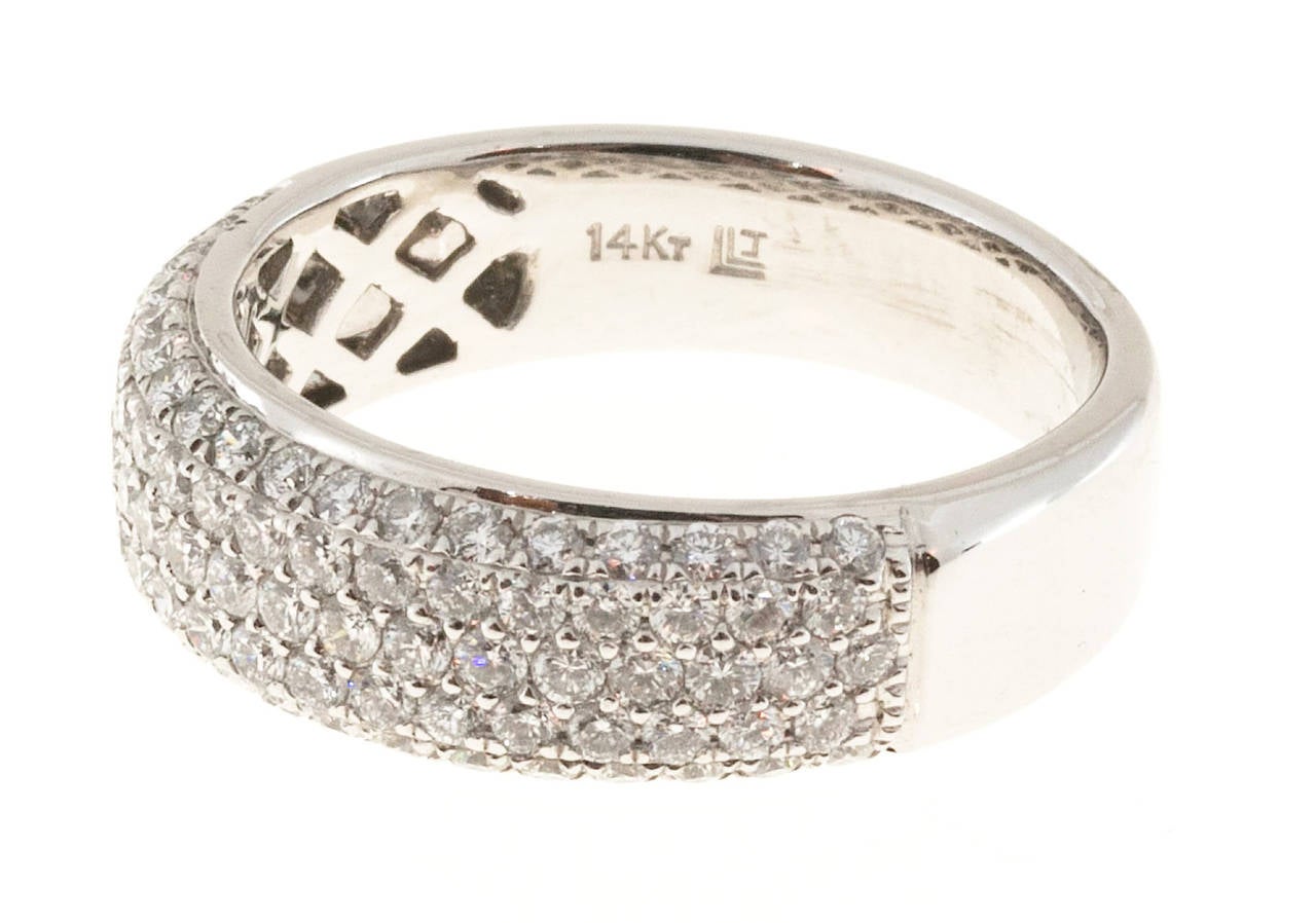 LLJ pave top diamond 1.25ct diamond band ring.

68 full cut diamonds, approx. total weight 1.25cts, F, VS
14k White Gold
Stamped: 14k LLJ
4.1 grams
Width at top: 6.4mm
Height at top: 3.4mm
Width at bottom: 4.7mm
Size 6 1/4 and sizeable