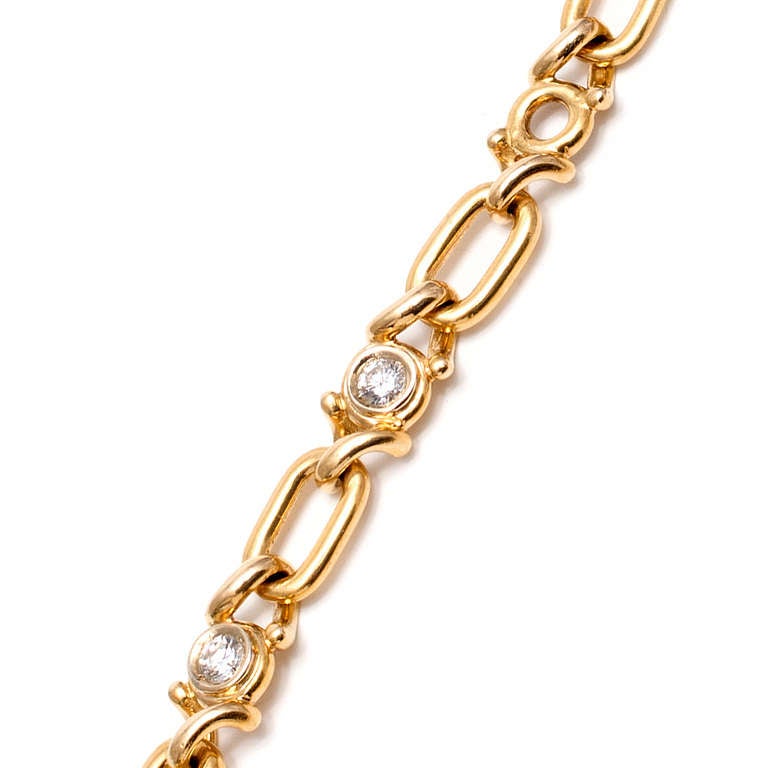 18k yellow gold link necklace. 7 Round diamonds set in center links. Made in France, signed Fred. 15.5 inches in length. 

7 round diamonds approx. total weight  1.70cts, E-F, V, VS.  
Stamped L  France 750 FRED. 
37.0 grams.  
¼ x 15 5/8 inches