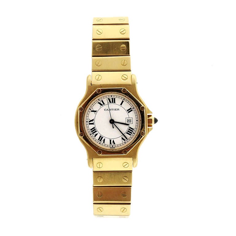 Solid 18k yellow gold round dial Santos with solid gold Santos band. Automatic date movement. Excellent condition. Looks great on the wrist. Recent service. Runs well.

18k Yellow gold 
106.7 grams 
 Length: 7.5 inches 
 Tip: 37.57mm 
 Width
