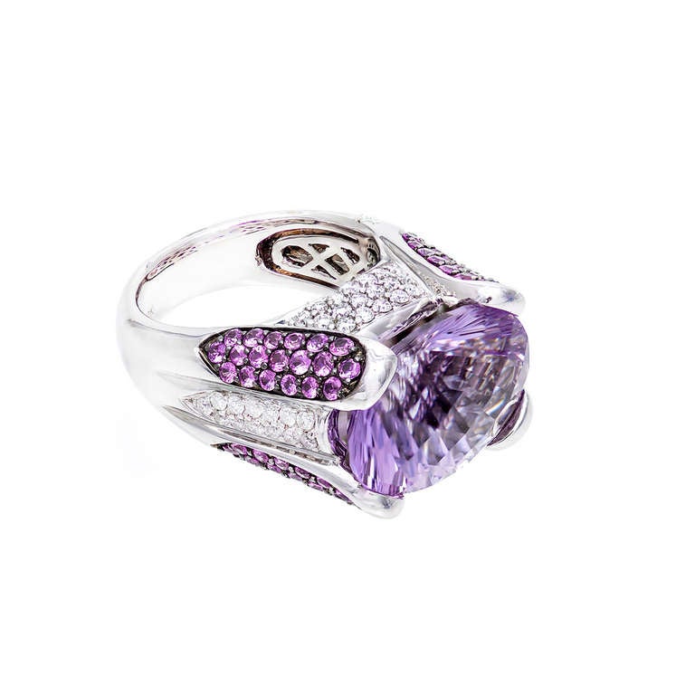 Light lavender genuine Fantasy cut Amethyst in a 18k white gold ring with  full cut diamonds and pink Sapphires. 

Oval natural color Amethyst Fantasy cut, light to medium purple, approx. total weight 11.00cts 18 x 13 x 2 mm

82 full cut
