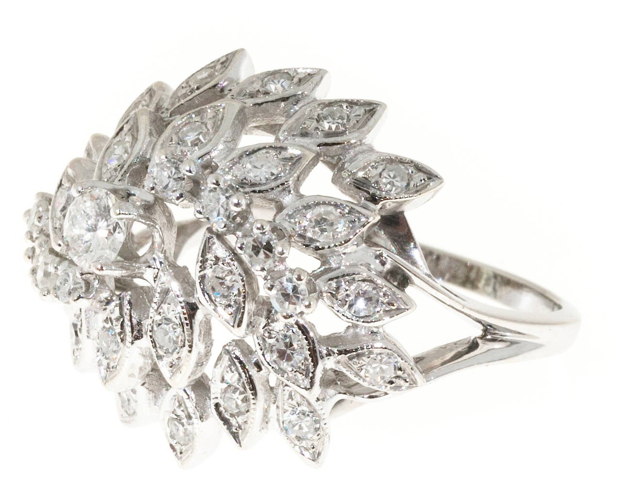 1950’s hurricane style 14k white gold pierced diamond dome ring. Also called the swirling dervish design. Set with excellent quality bright white diamonds.

27 round diamonds approx. total weight 1.00cts, F, VS-SI
14k White Gold
Stamped 14k