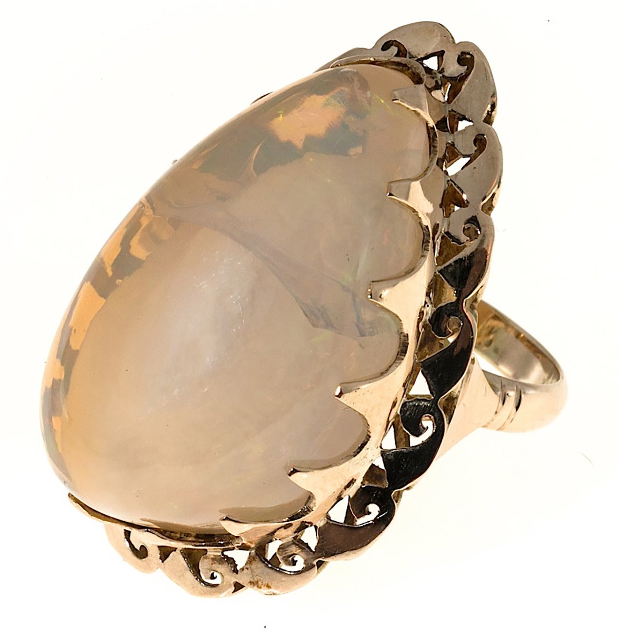 Interesting, rare and one of a kind handmade ring in 14k yellow gold. Set with a large one of a kind opal specimen. In the center of the opal is a white opal section with orange, green and blue flash. Surround that is an opal section of clear