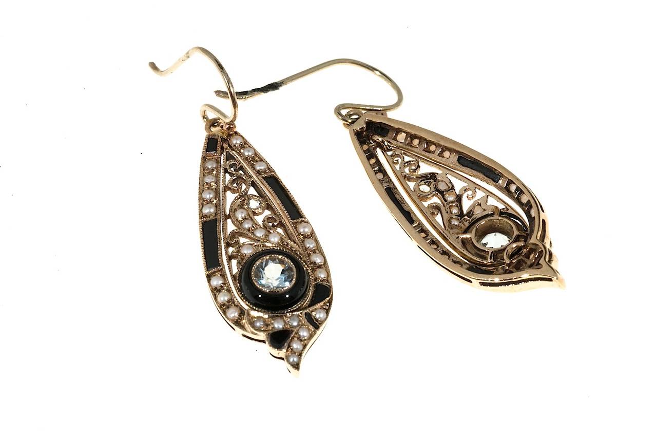 Victorian 9k pink gold dangle earrings with hand cut Onyx genuine Aqua and genuine pearls. 

2 4mm and 2 1mm genuine Aqua
52 half pearls 1.5mm
12 custom cut genuine black Onyx
Tested: 9k gold
5.8 grams
Top to bottom: 1 3/4 inch or