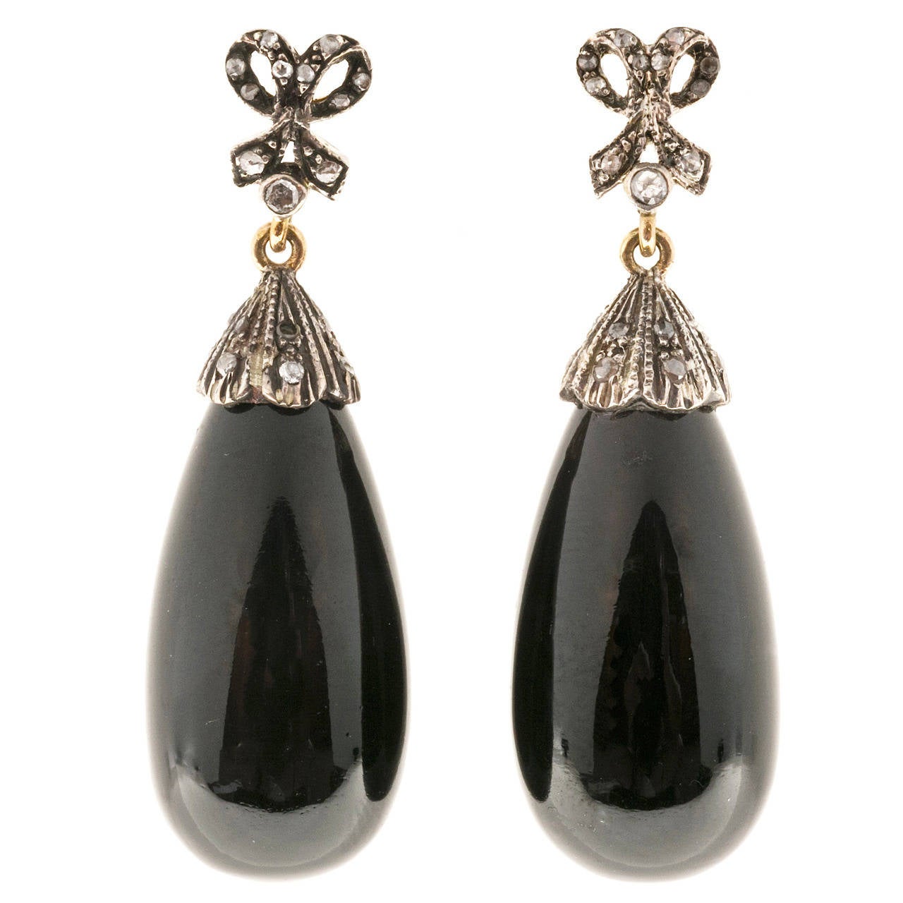 Onyx and diamond 18k rose gold silver topped dangle earrings. Rose cut diamonds and tear shaped black Onyx. 
  
2 tear drop black Onyx, approx. total weight 58.00cts, 28 x 13mm, black opaque
44 rose cut diamonds, approx. total weight .25cts, J,