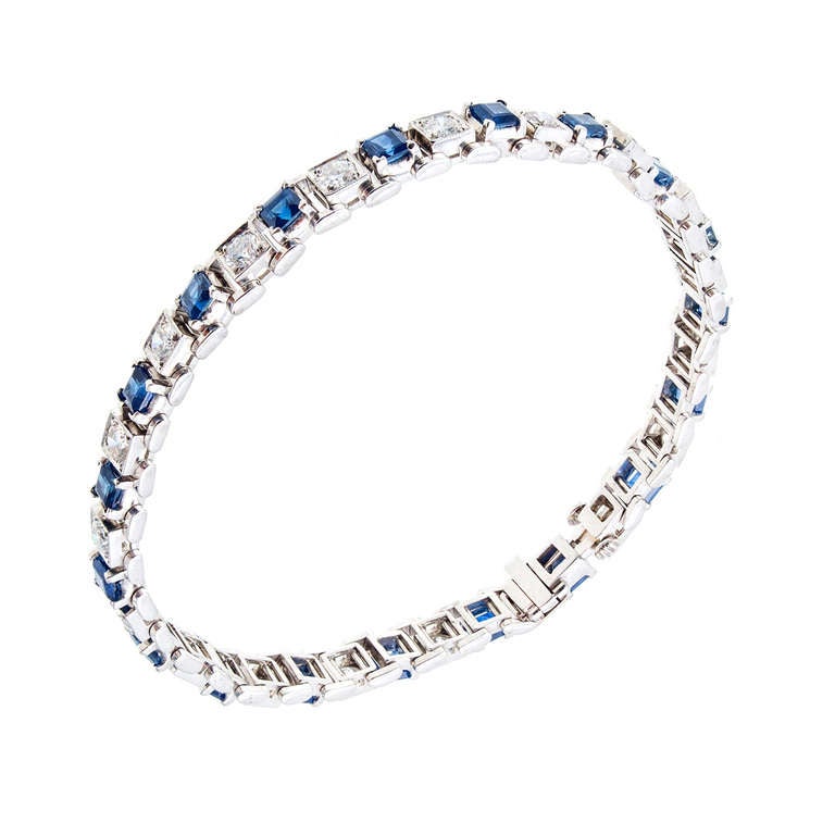 Platinum 1940-1950 late Art Deco hinged link bracelet with square step cut genuine Sapphires and fine white brilliant cut diamonds. Hidden box catch and underside safety. 

19 full cut diamonds approx. .06ct each, approx. total weight 1.14cts, G,