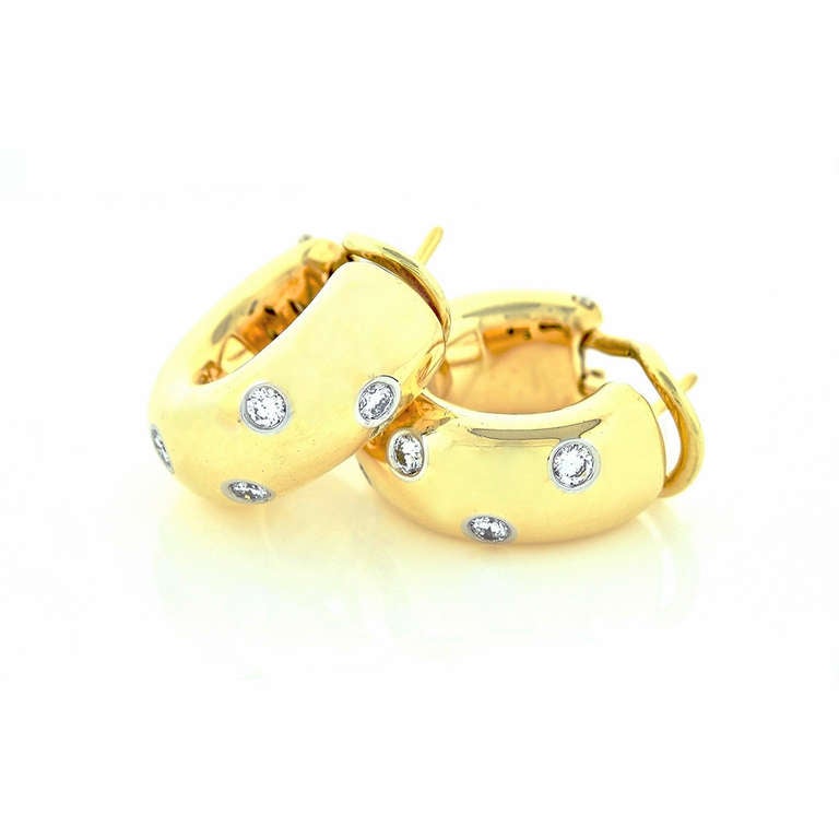 Tiffany & Co diamond clip post classic Etoile style 18k yellow gold earrings with diamonds in Platinum  tubes. Excellent condition. Looks great on the ear.

18k Yellow gold and Platinum 950

8 round Ideal brilliant cut diamonds, approx. total