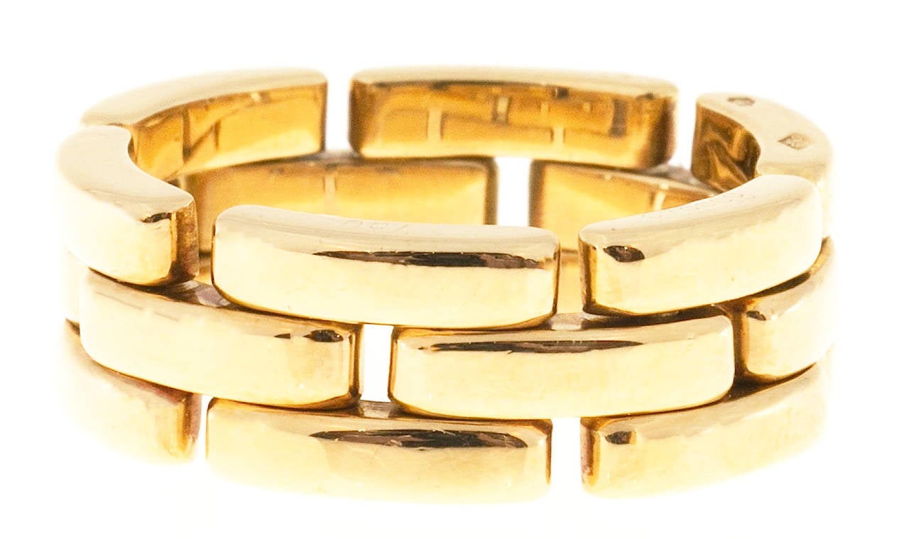 Three row panther link 18k yellow gold ring.  Stamp is a bit worn.

Solid 3 row  link
Stamped: 750 656626 European hallmarks
18k Yellow Gold
8.1 grams
Depth: 2.5mm
Width: 8.2mm
Size 7 1/2
