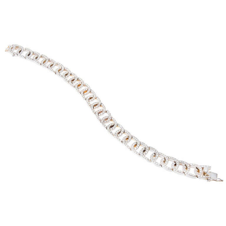 Diamond 14k white gold hinged oval link bracelet with hidden built in catch and side lock safety.   

387 round full cut diamonds approx. total weight 4.00cts, G, VS2 to SI1
14k White gold
Stamped: 14k white gold         
Length: 7 3/8 inches  