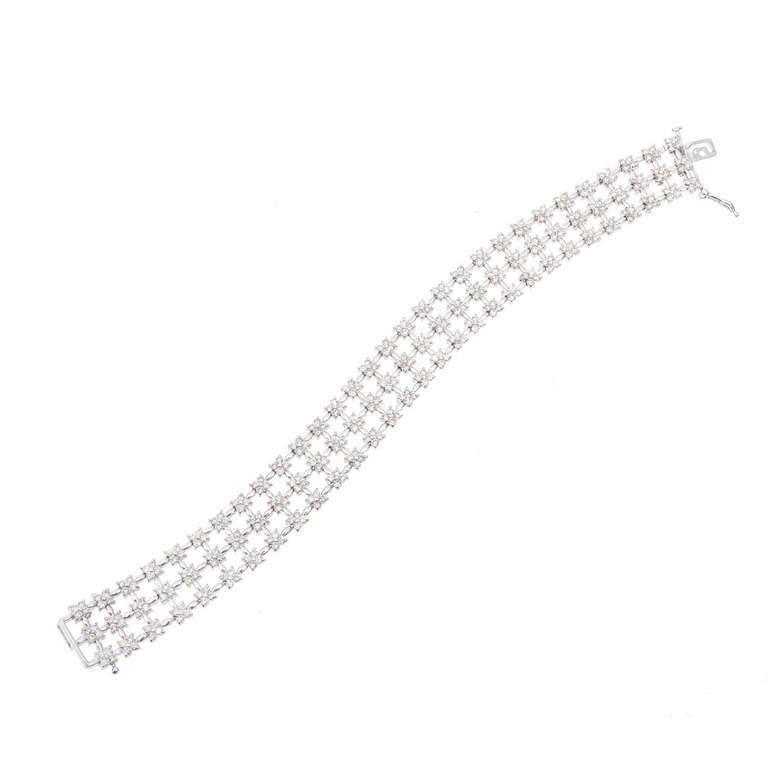 Beautiful 360 diamond 4.00ct 3 row cluster style diamond bracelet. All full cut bright shiny diamonds. Tight cluster of 4 diamonds.      
        
360 full cut diamonds approx. total weight 4.00cts, I-J, VS1-SI1                    
Side lock