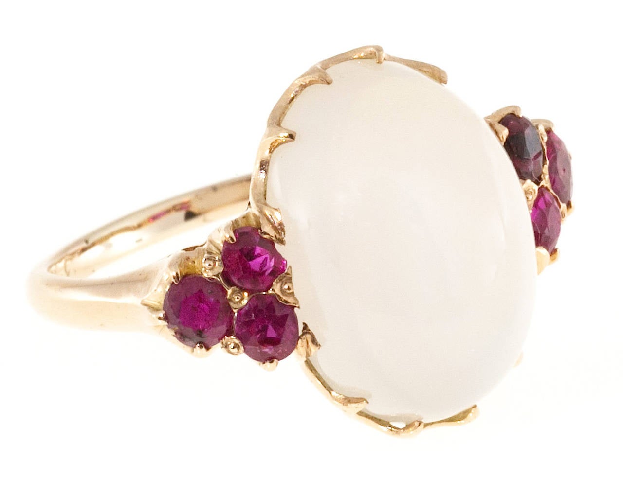 Original 14k pink gold Retro Art Deco 1943 Moonstone and Ruby ring.  On a pink gold scale of 1 to 10 with 10 as the deepest pink this scores a 7.

1 oval clear, slightly milky translucent Moonstone, approx. total weight 5.50cts, VS 15.5 x 10.5 x